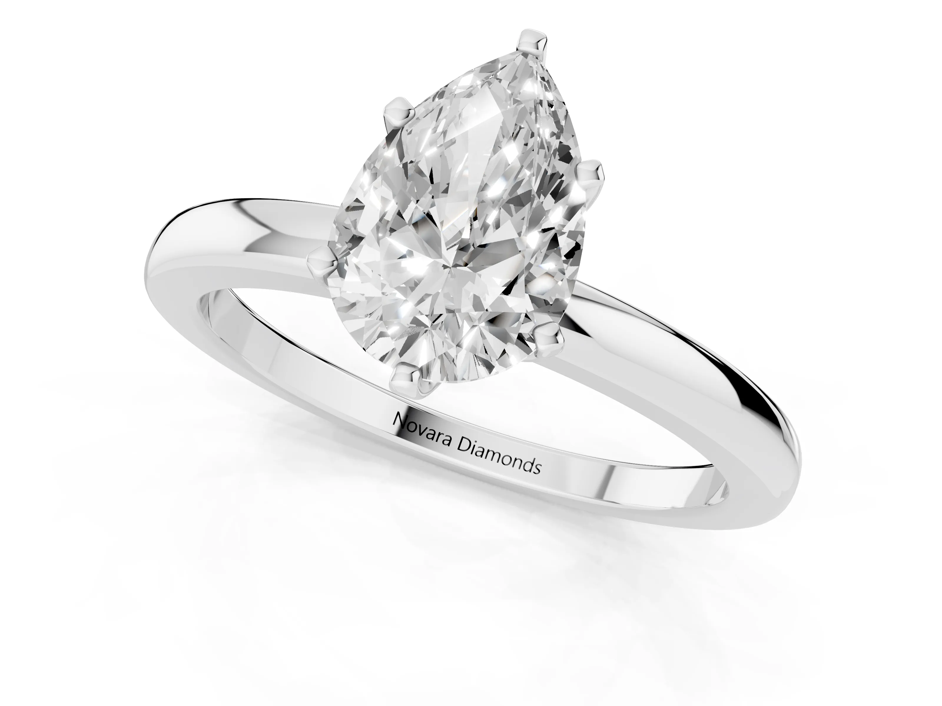 Pear Cut Diamond Solitaire Ring Set in White gold with Raised Prong Setting on a Classic Band