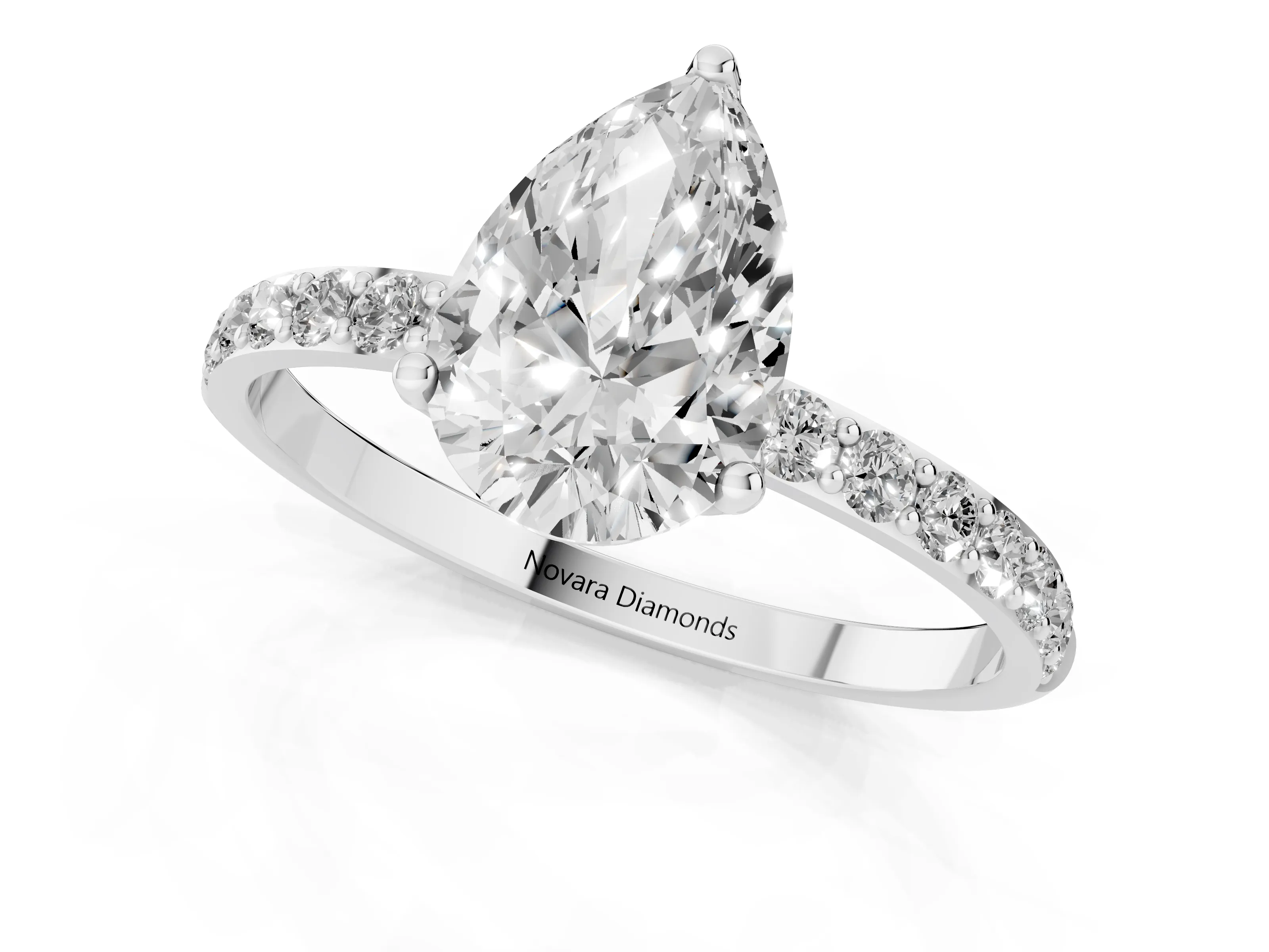 Pear Cut Diamond Solitaire Engagement Ring Set in White gold with Round Pavé Band and Prong Setting