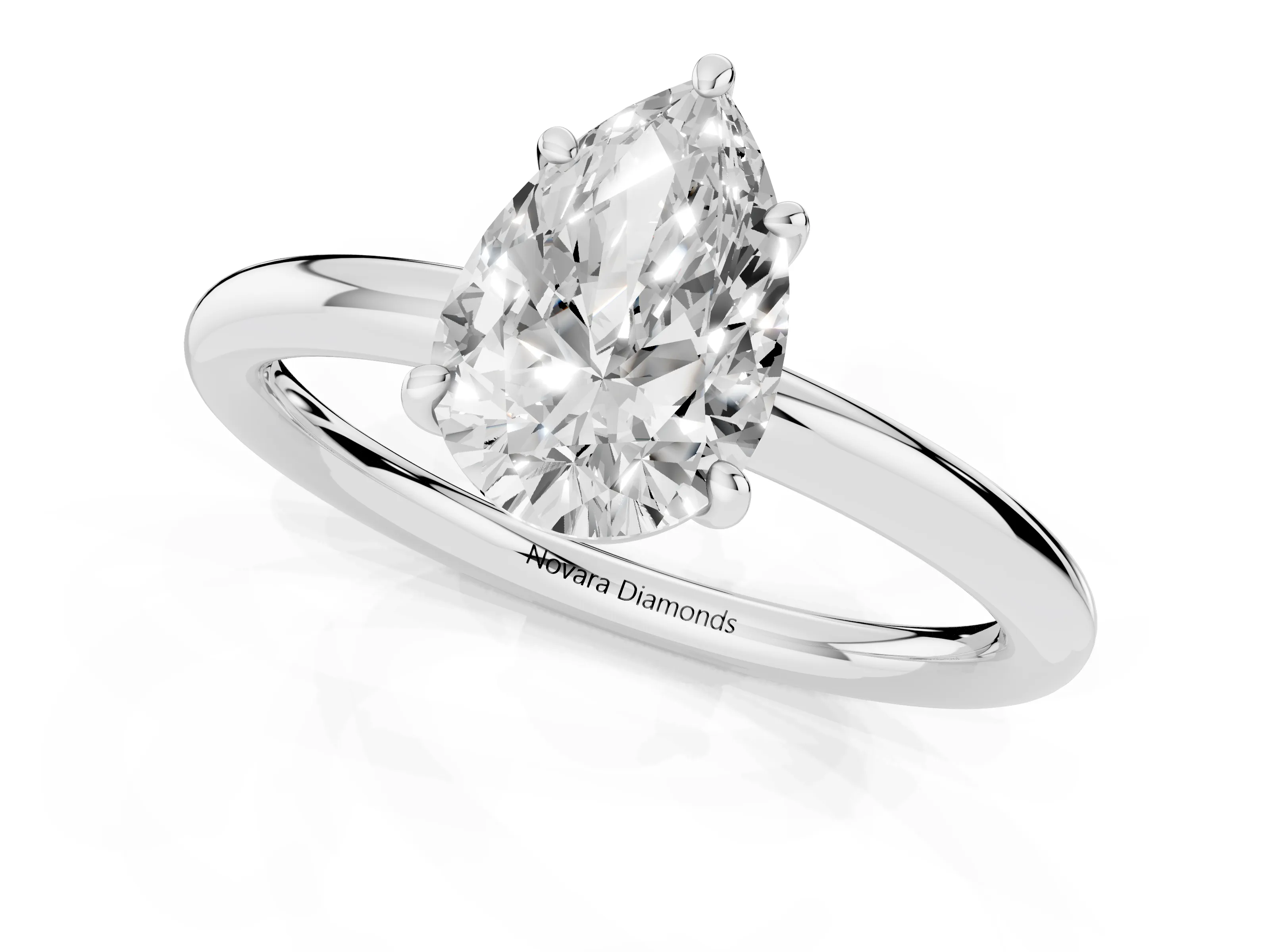 Pear Cut Diamond Solitaire Ring Set in White gold with Prong Setting on a Polished Plain Band