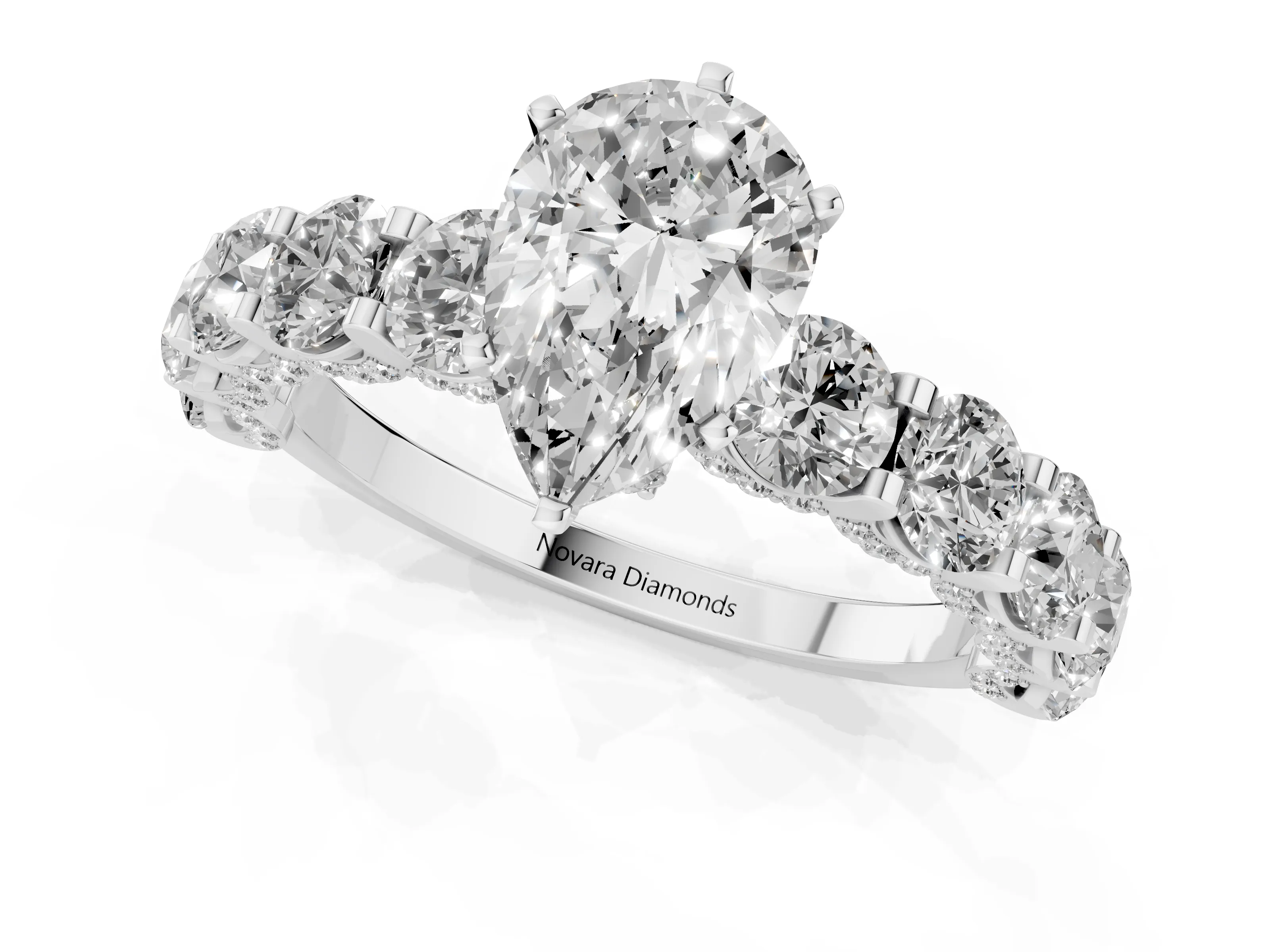 Pear Cut Diamond Side Stone Ring Set in White gold with Alternating Round and Oval Side Stones