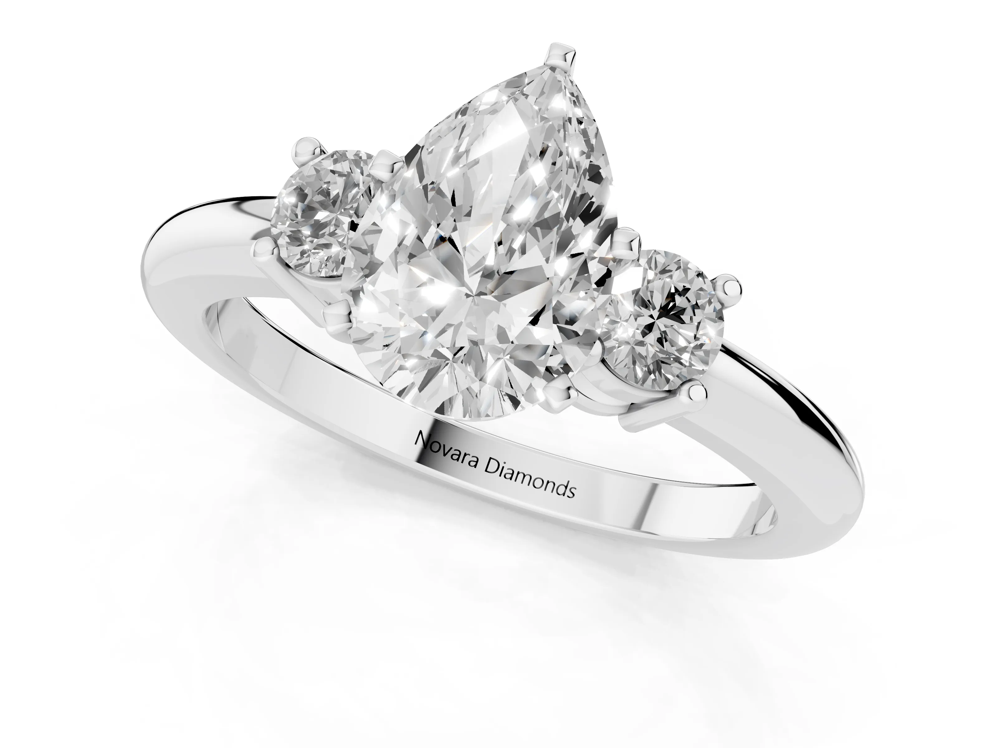 Three-Stone Pear Cut Diamond Ring Set in White gold with Prong Setting and Plain Band