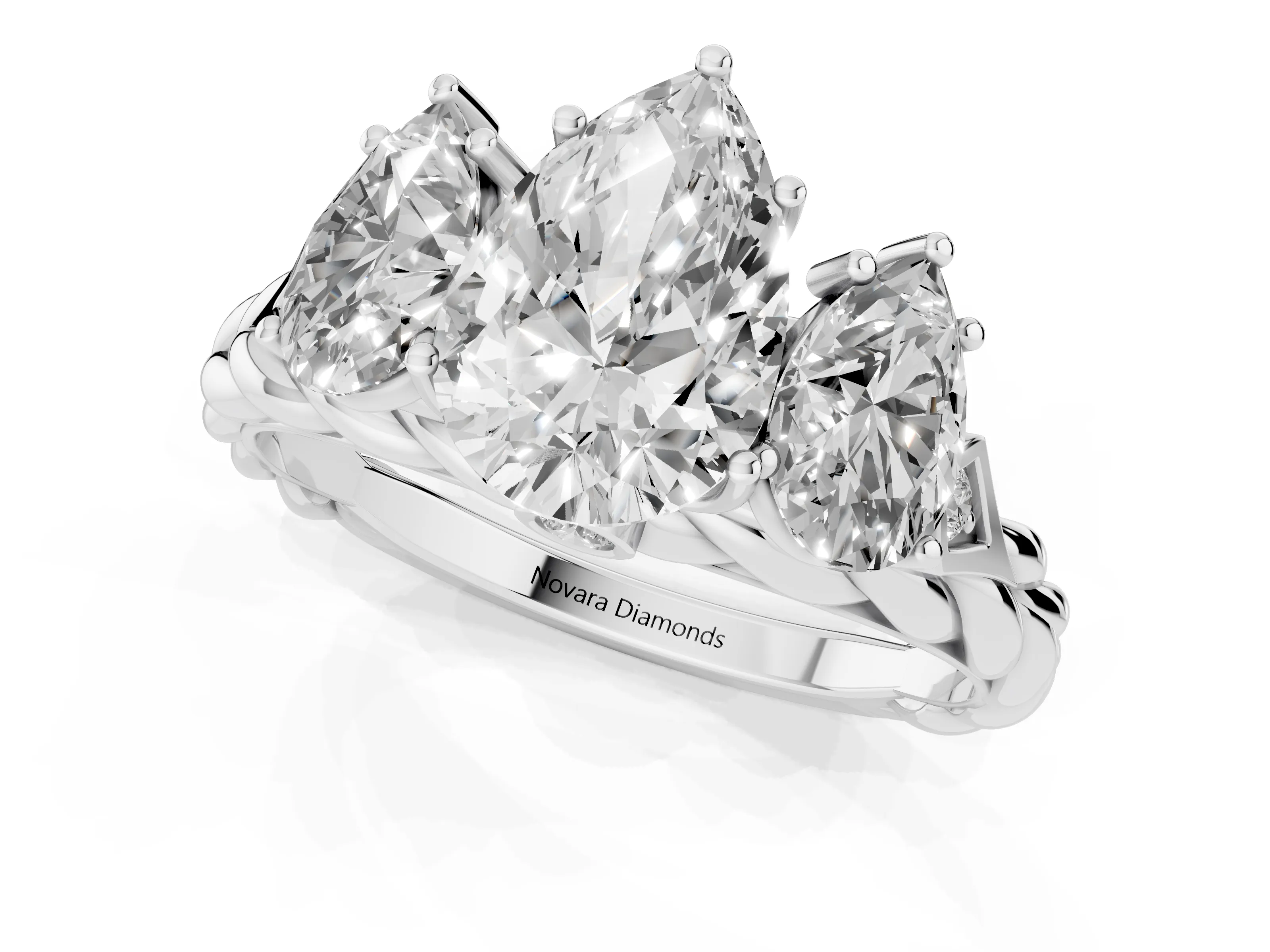 Pear Cut Diamond Three-Stone Ring Set in Platinum with Braided Band