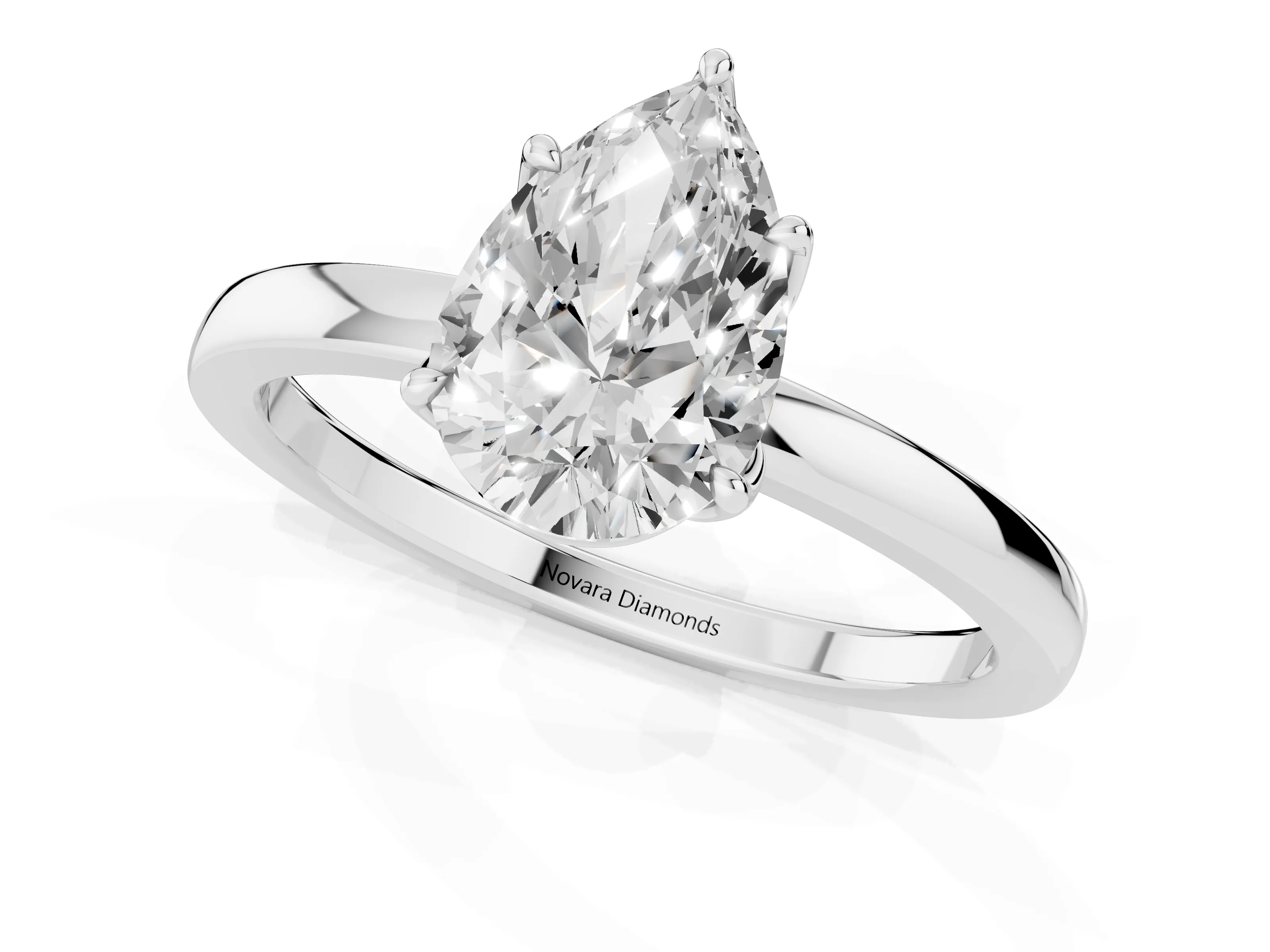 Pear Cut Diamond Solitaire Ring Set in Silver with Prong Setting and Thin Polished Band