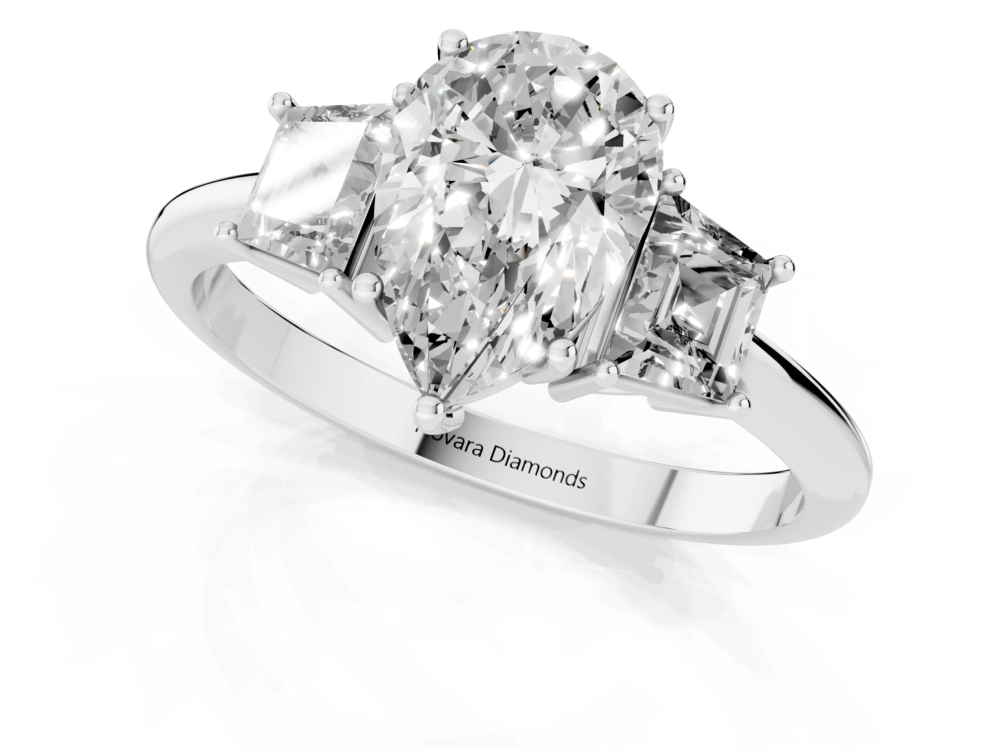 Pear Cut Diamond Three-Stone Ring Set in White gold with Trapezoid Side Stones and Prong Setting
