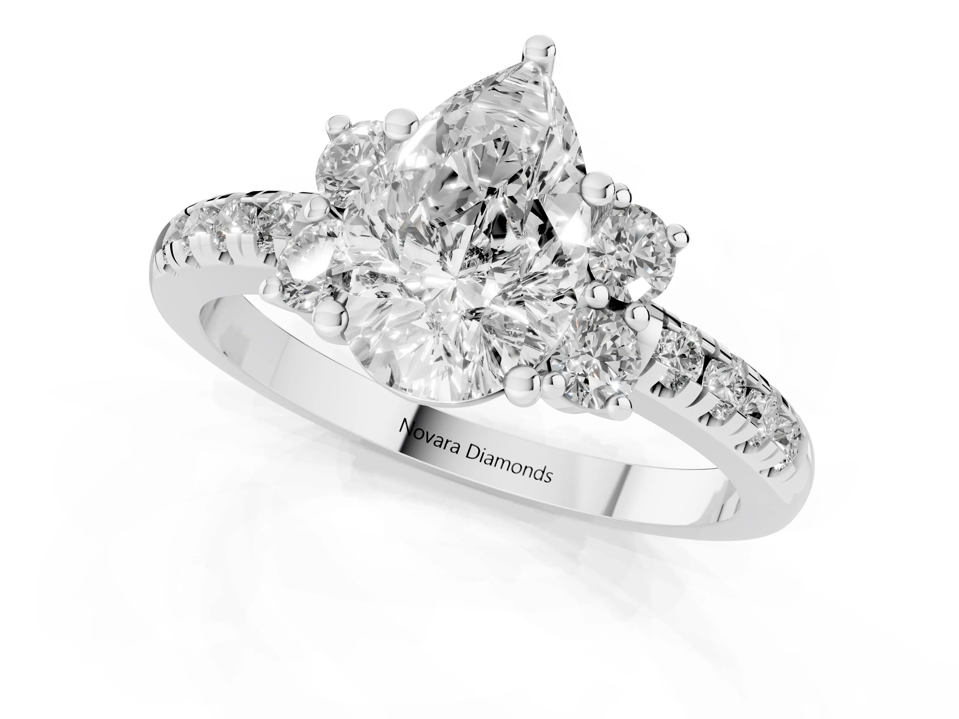 Pear Cut Diamond Three-Stone Pavé Ring Set in Platinum with Prong Setting