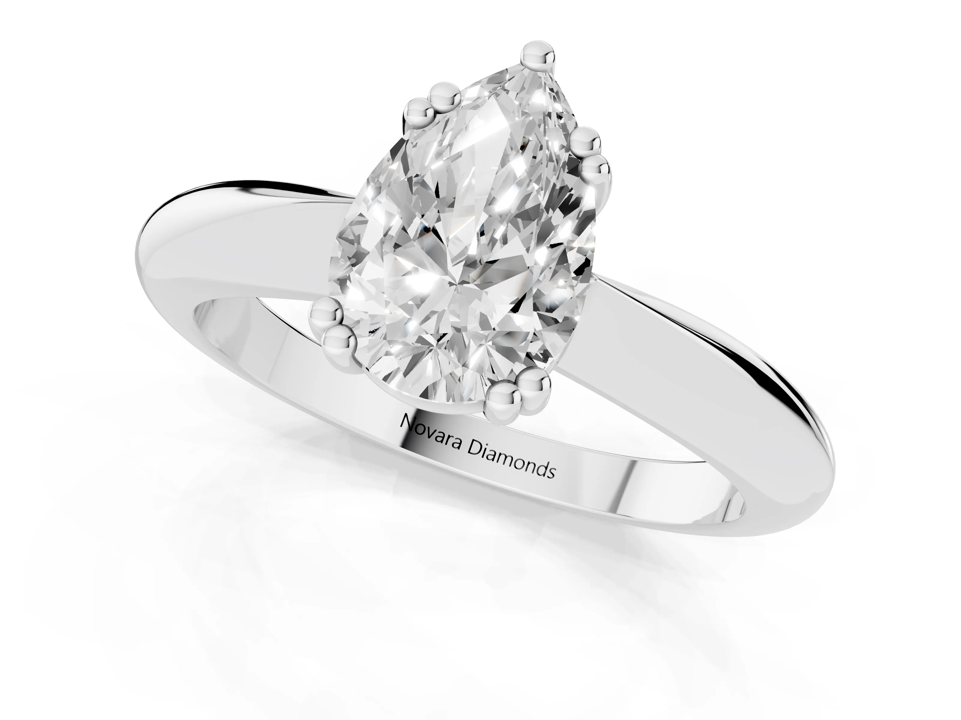 Pear Cut Diamond Solitaire Engagement Ring Set in Platinum with Tapered Band and Prong Setting