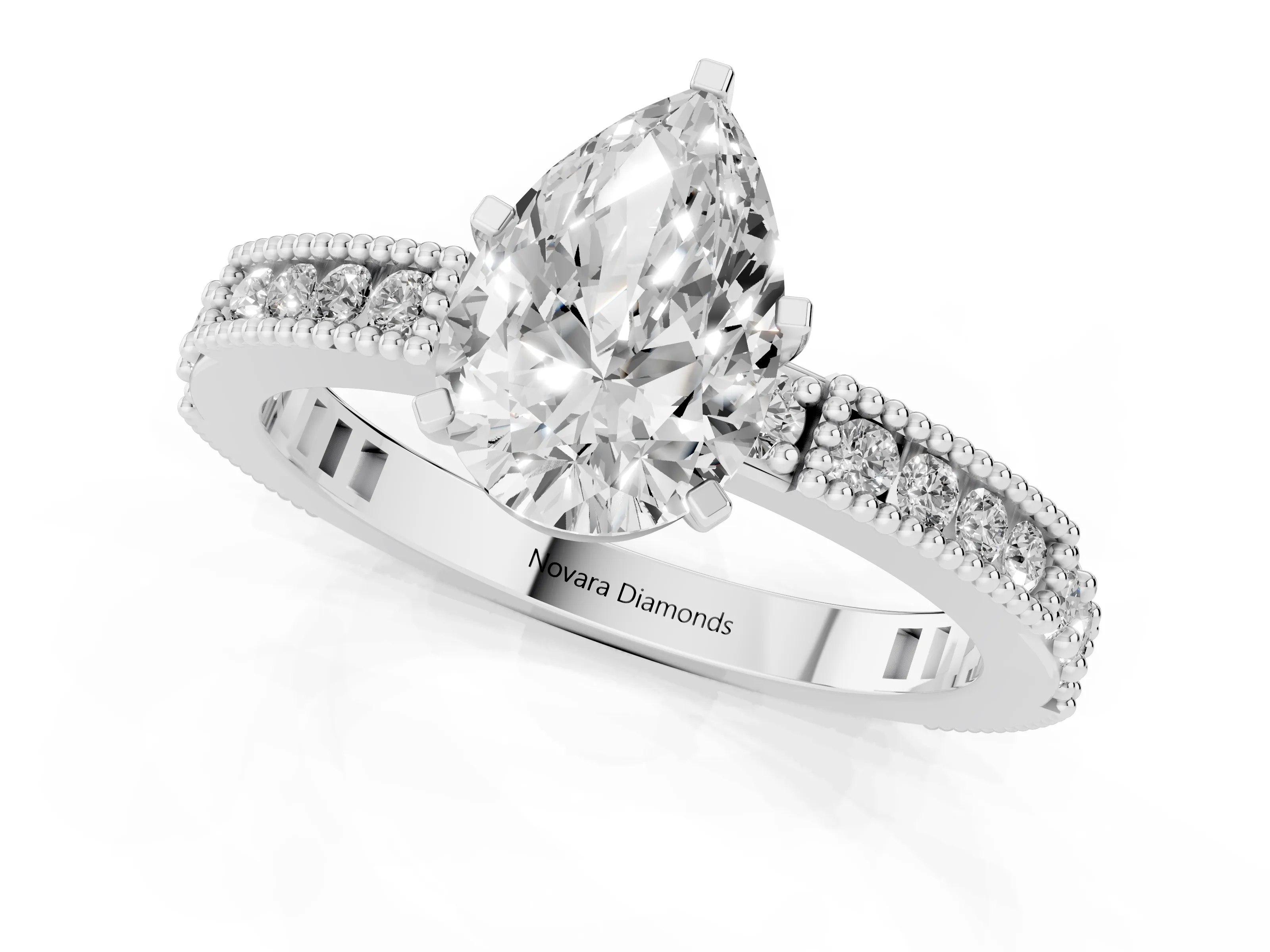 Pear Cut Diamond Solitaire Ring Set in Platinum with Slim Pavé Band and Prong Setting
