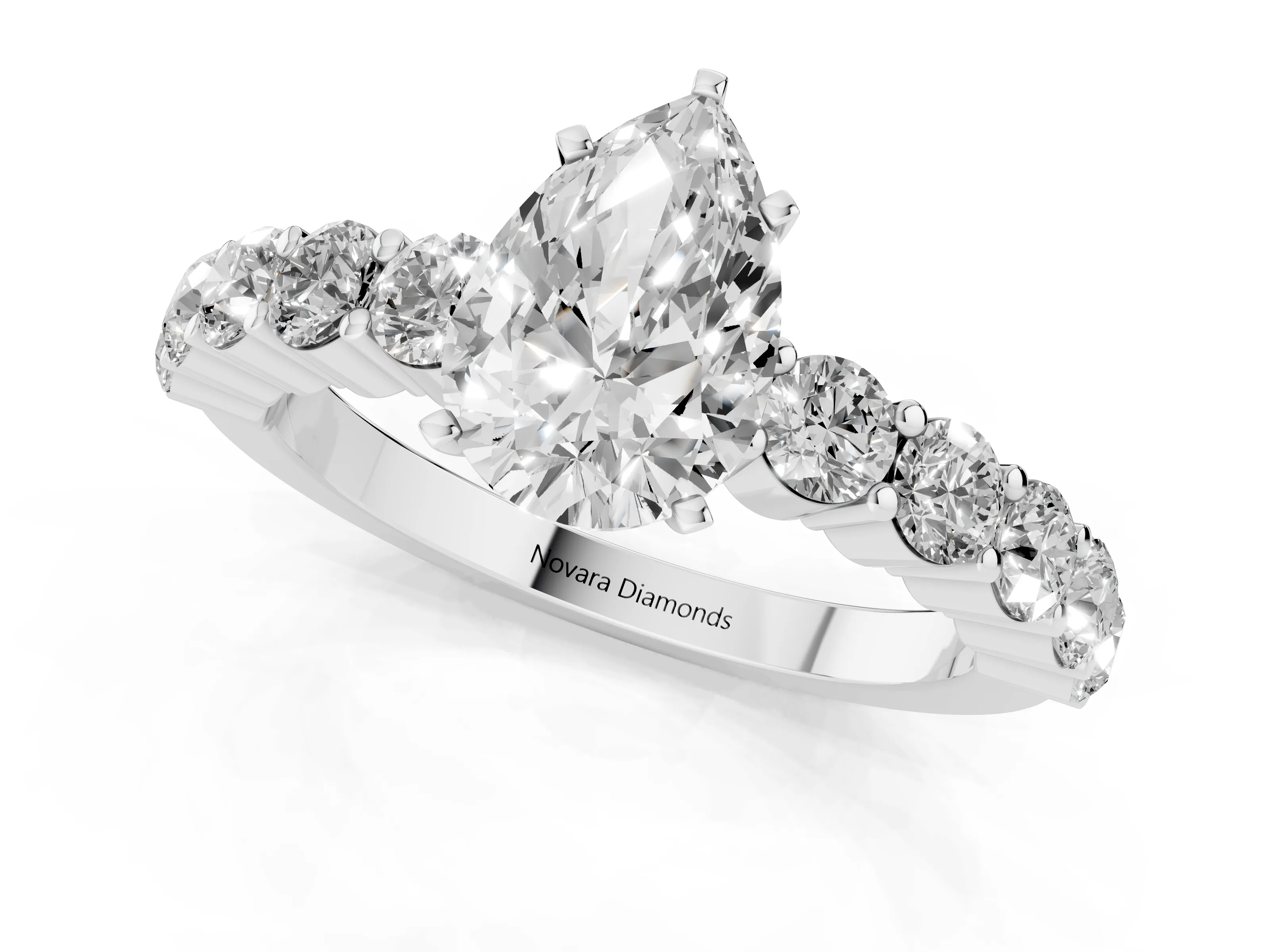 Pear Cut Diamond Solitaire Ring Set in Silver with Shared Prong Round Side Stones