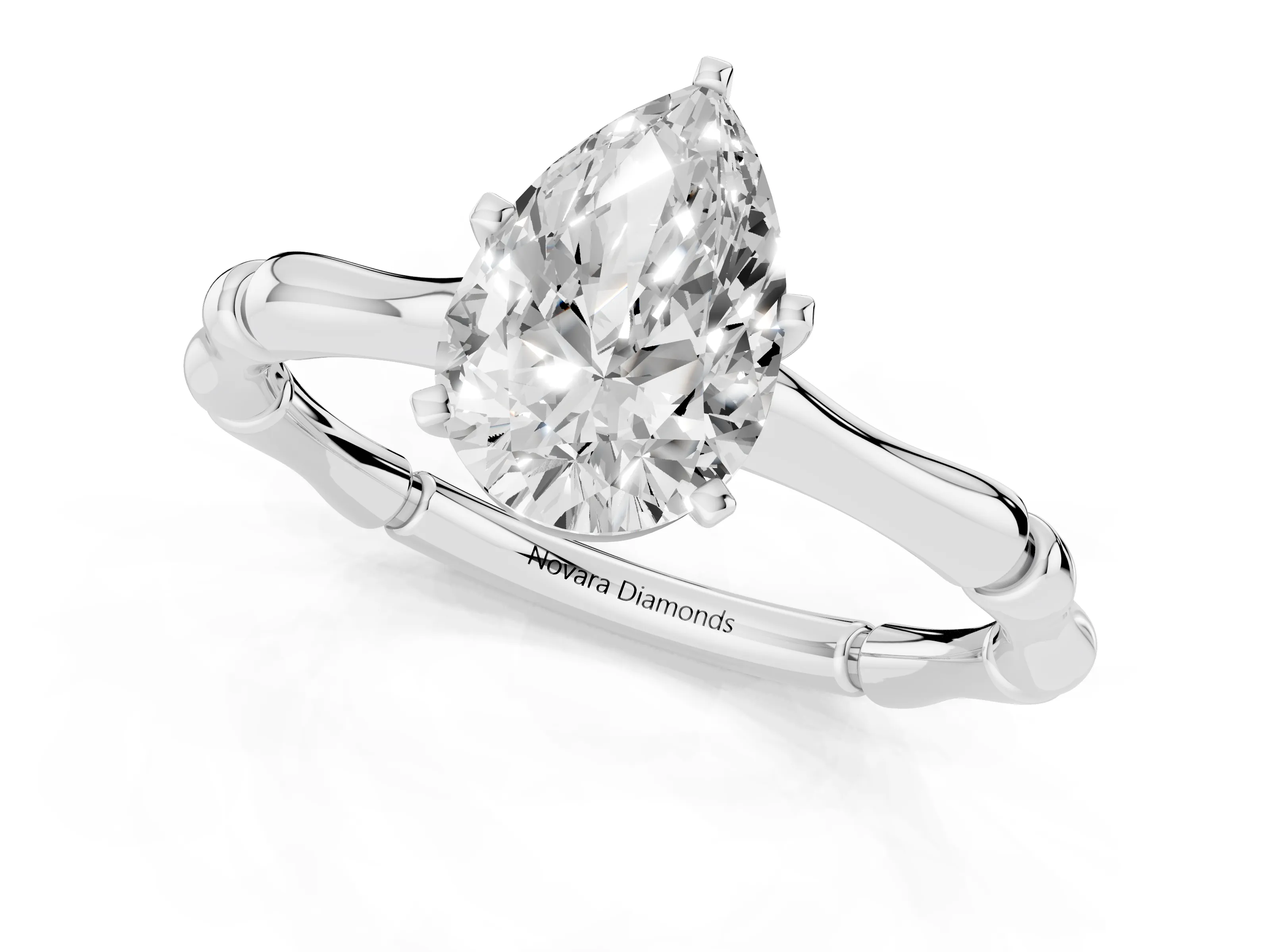 Pear Cut Diamond Solitaire Ring Set in Silver with Bamboo Band and Prong Setting