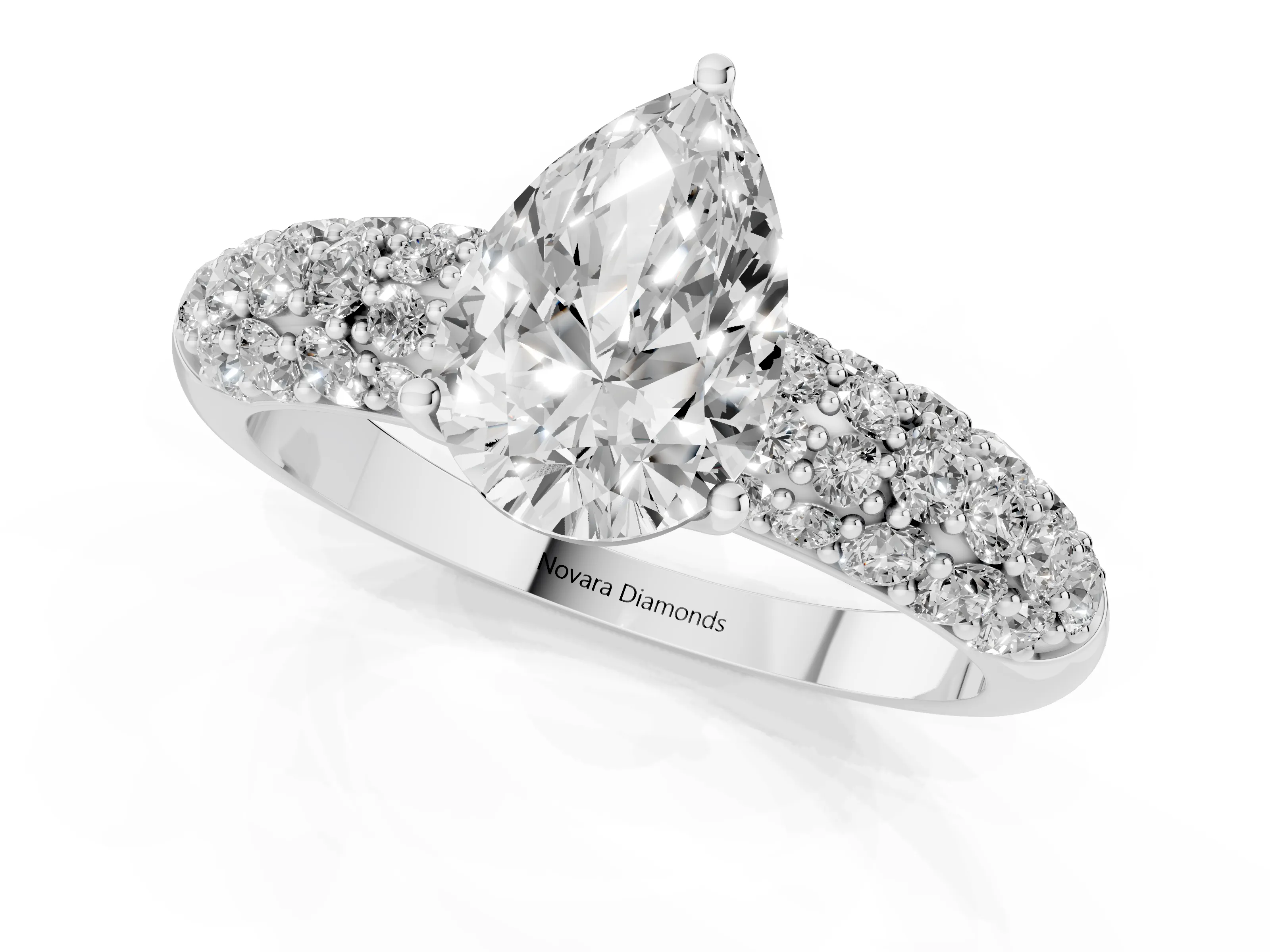 Pear Cut Diamond Pavé Band Solitaire Ring Set in White gold with Close-Set Accent Stones and Prong Setting