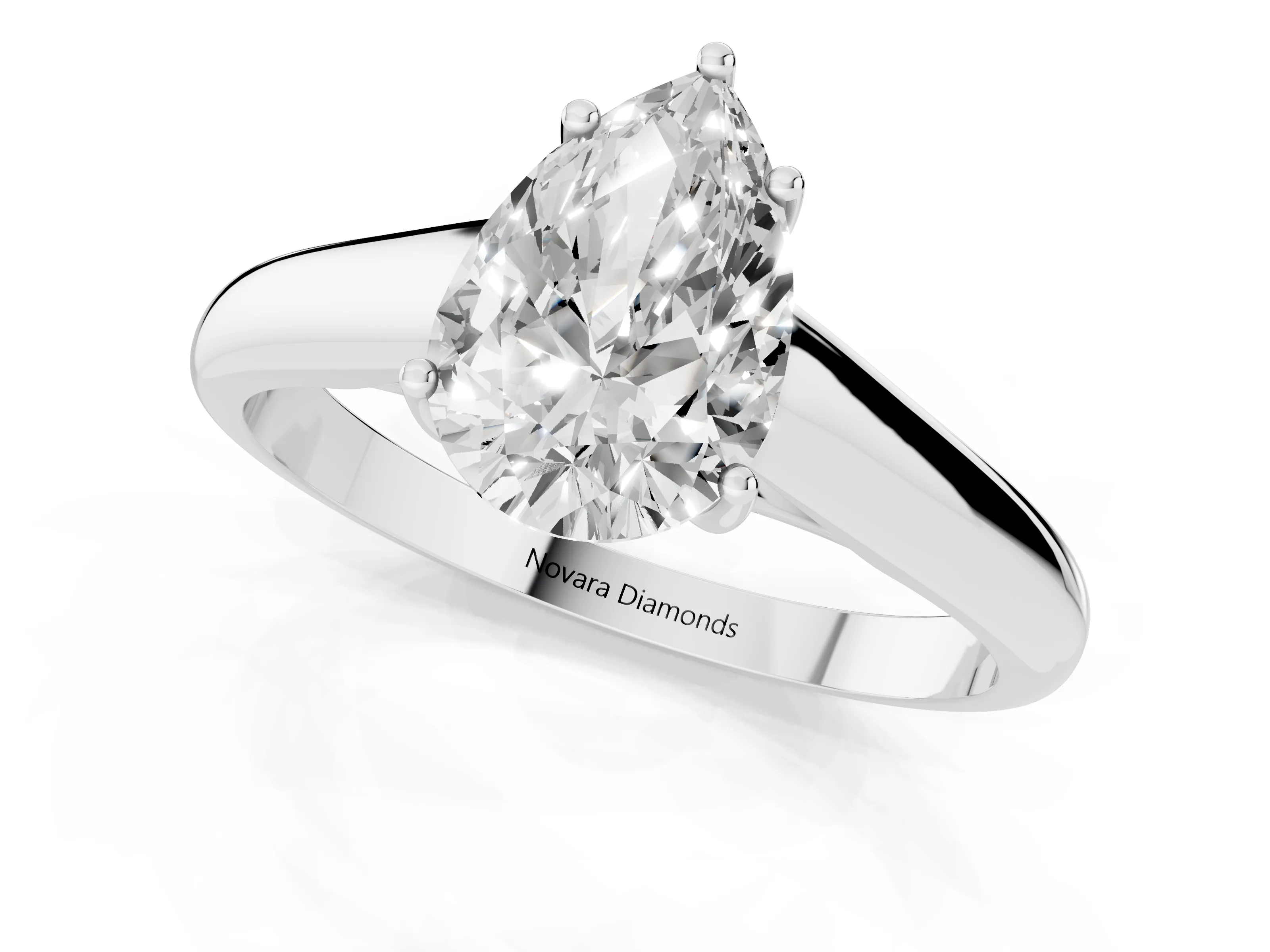 Pear Cut Diamond Solitaire Engagement Ring Set in Platinum with Subtly Tapered Band and Prong Setting