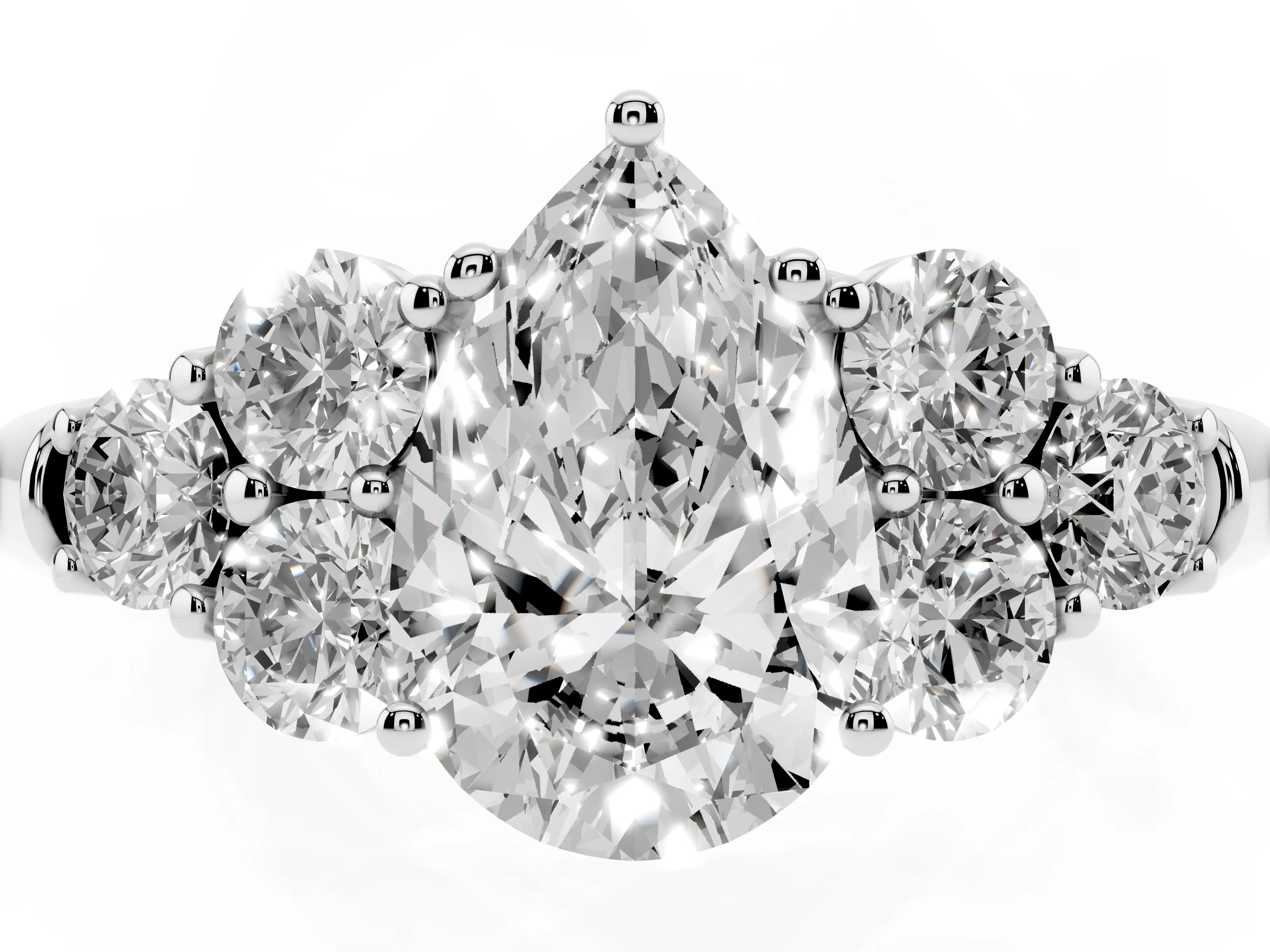 Pear Cut Diamond Cluster Ring Set in Platinum with Round Accent Stones and Prong Setting on a Plain Band
