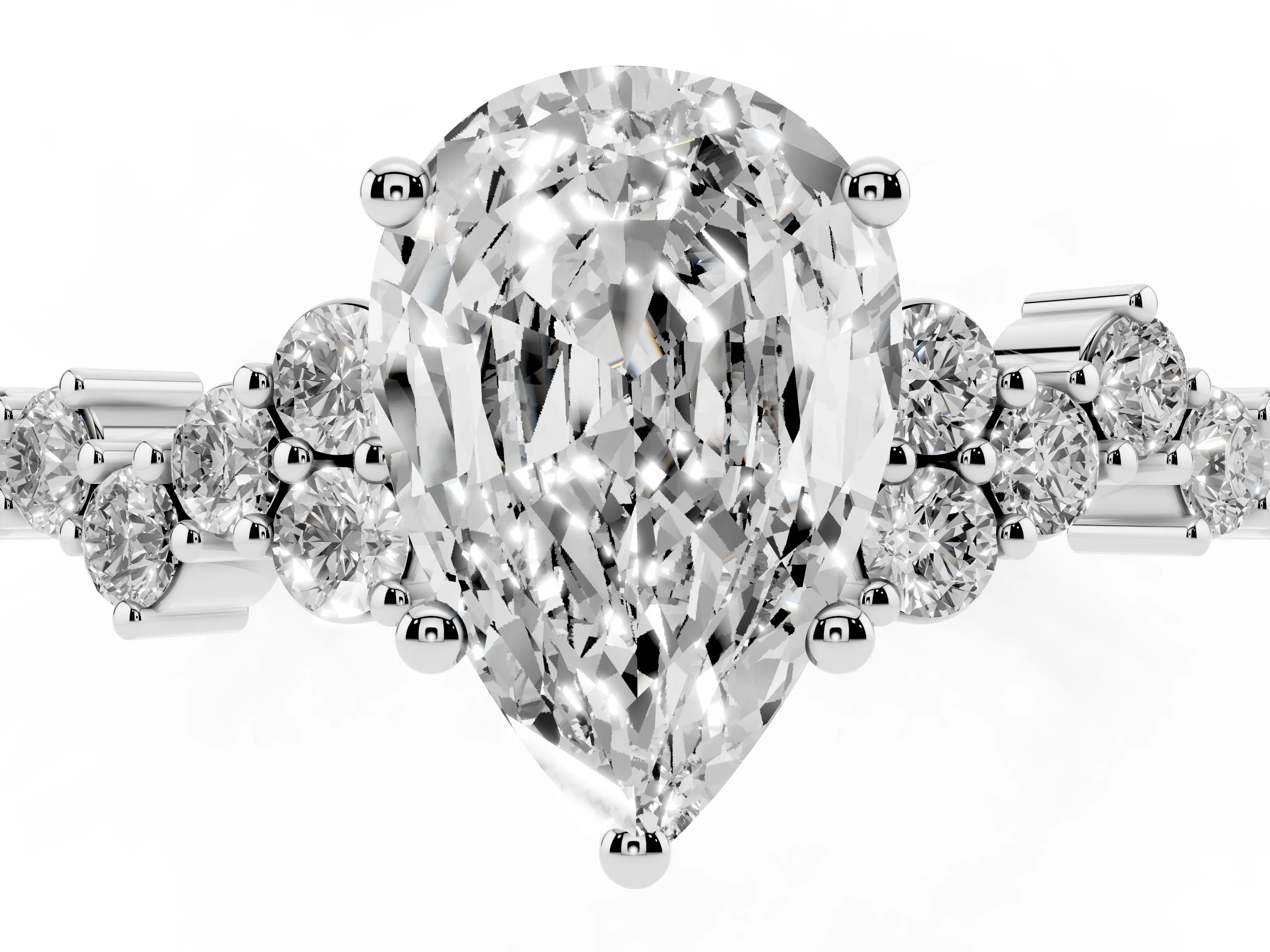 Pear Cut Diamond Ring Set in Platinum with Scattered Round Accents