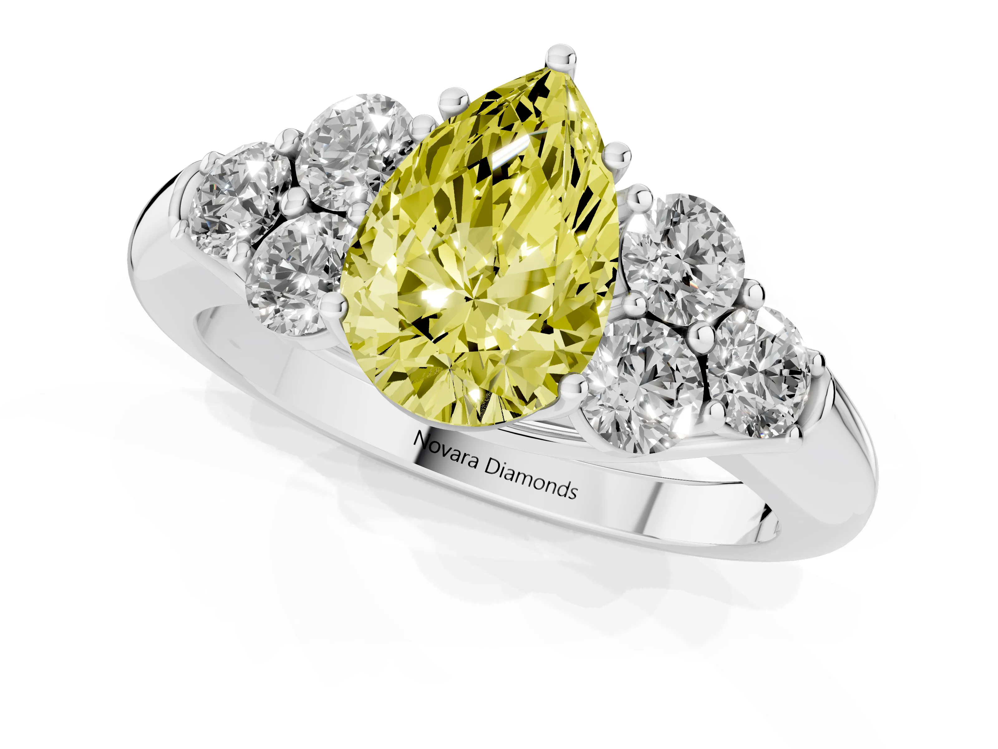 Fancy Yellow Pear Cut Diamond Cluster Ring Set in Platinum with Round Accent Stones and Prong Setting on a Plain Band