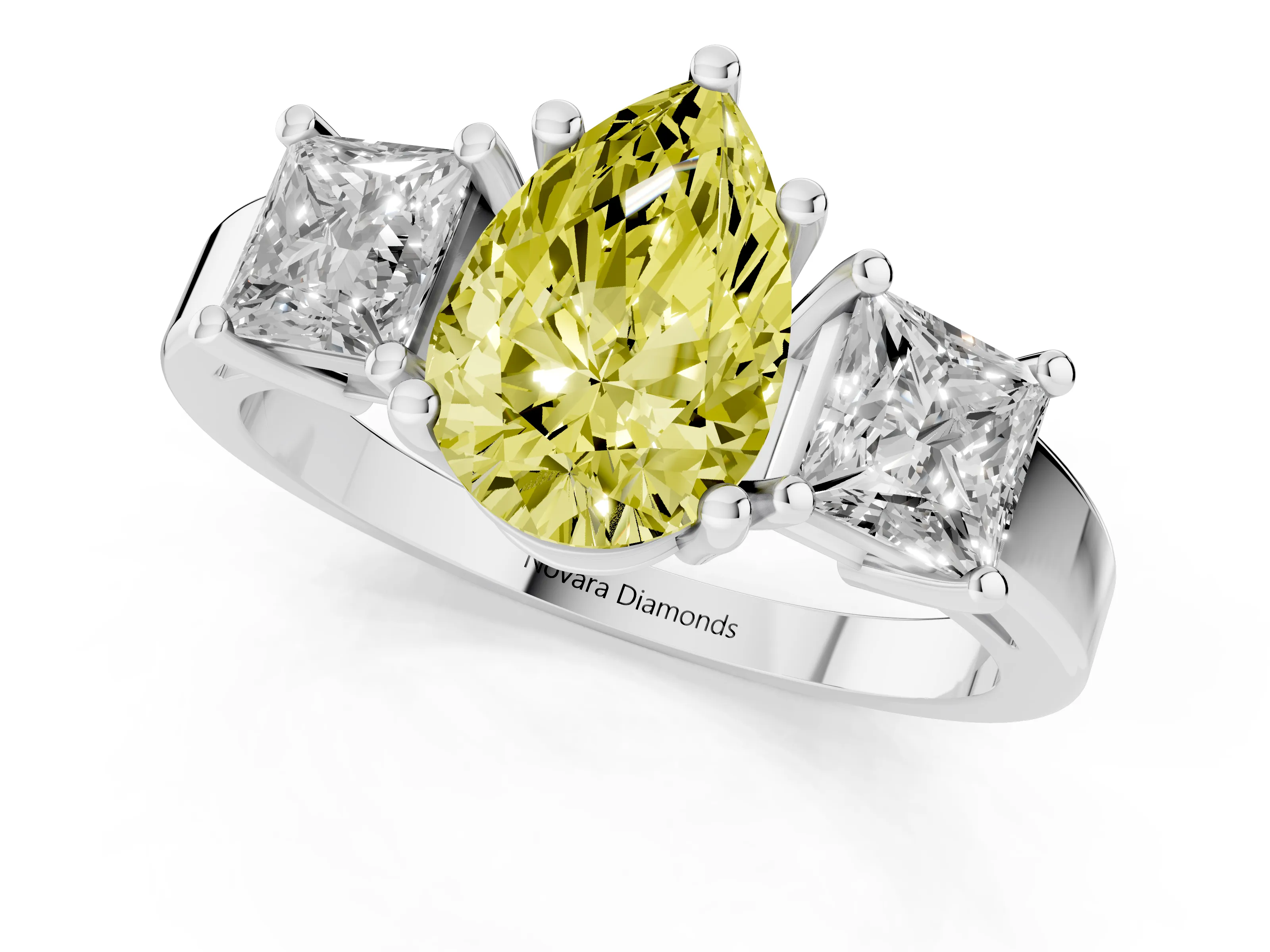 Fancy Yellow Three-Stone Pear Cut Diamond Solitaire Ring Set in Platinum with Prong Setting