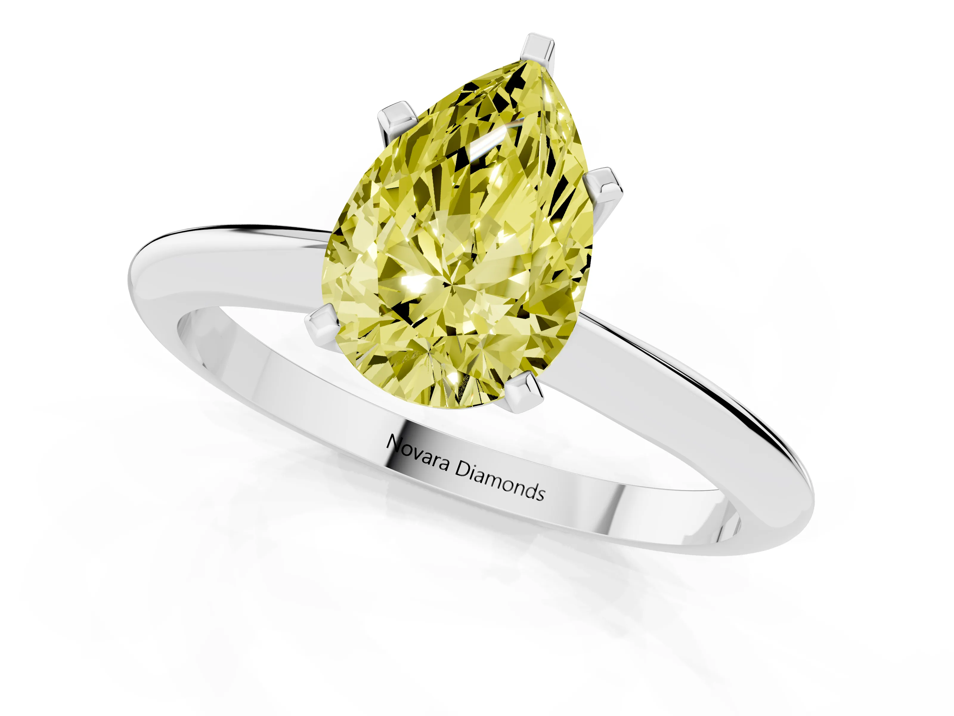 Fancy Yellow Pear Cut Diamond Solitaire Ring Set in Silver with Prong Setting on a Plain Round Band