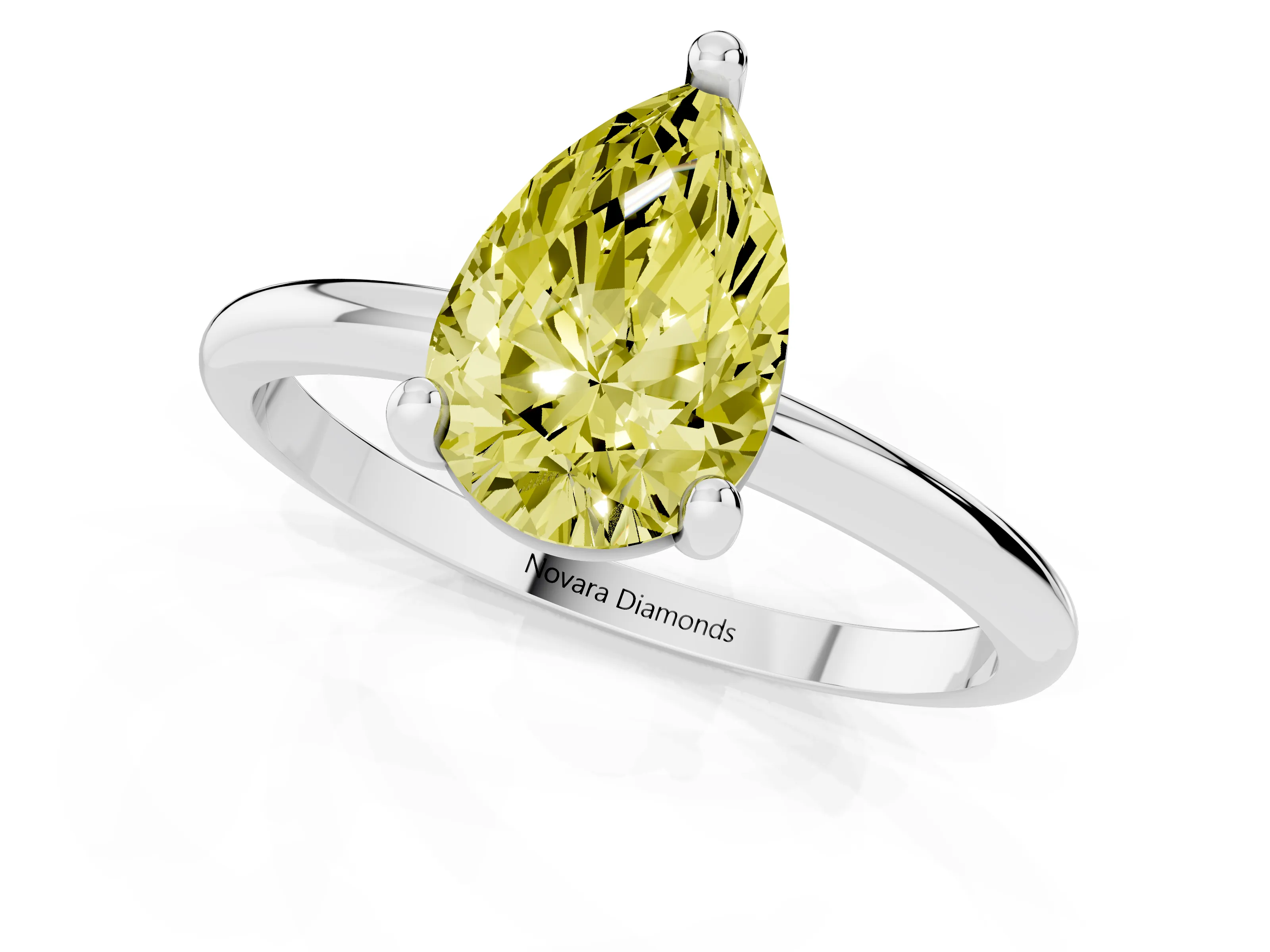 Fancy Yellow Pear Cut Diamond Solitaire Ring Set in Silver with Secure Prong Setting on a Classic Band
