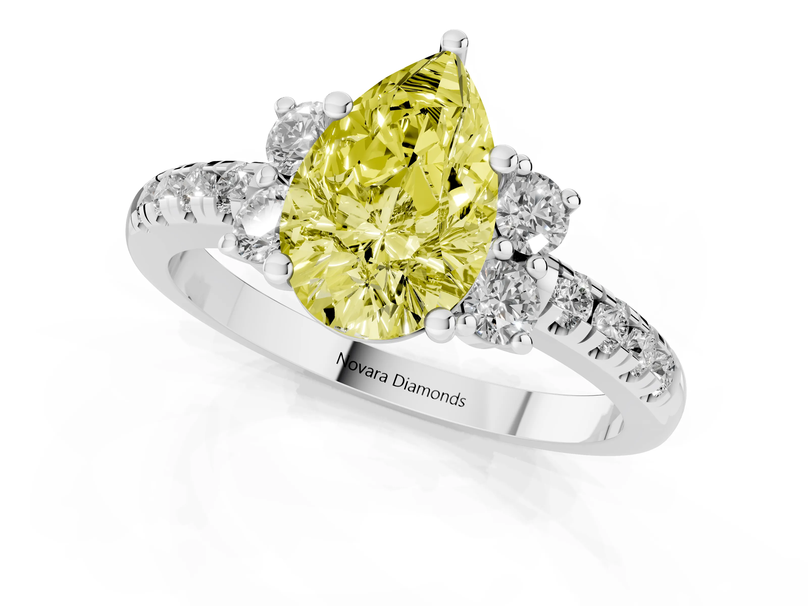 Fancy Yellow Pear Cut Diamond Three-Stone Pavé Ring Set in White gold with Prong Setting