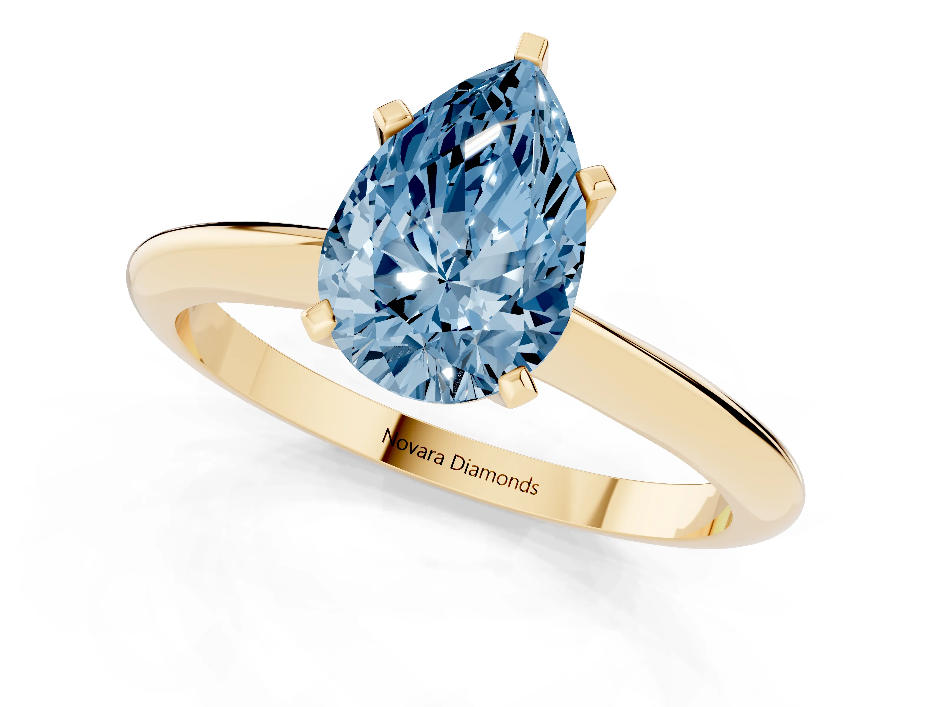 Fancy Blue Pear Cut Diamond Solitaire Ring Set in Yellow gold with Prong Setting on a Plain Round Band