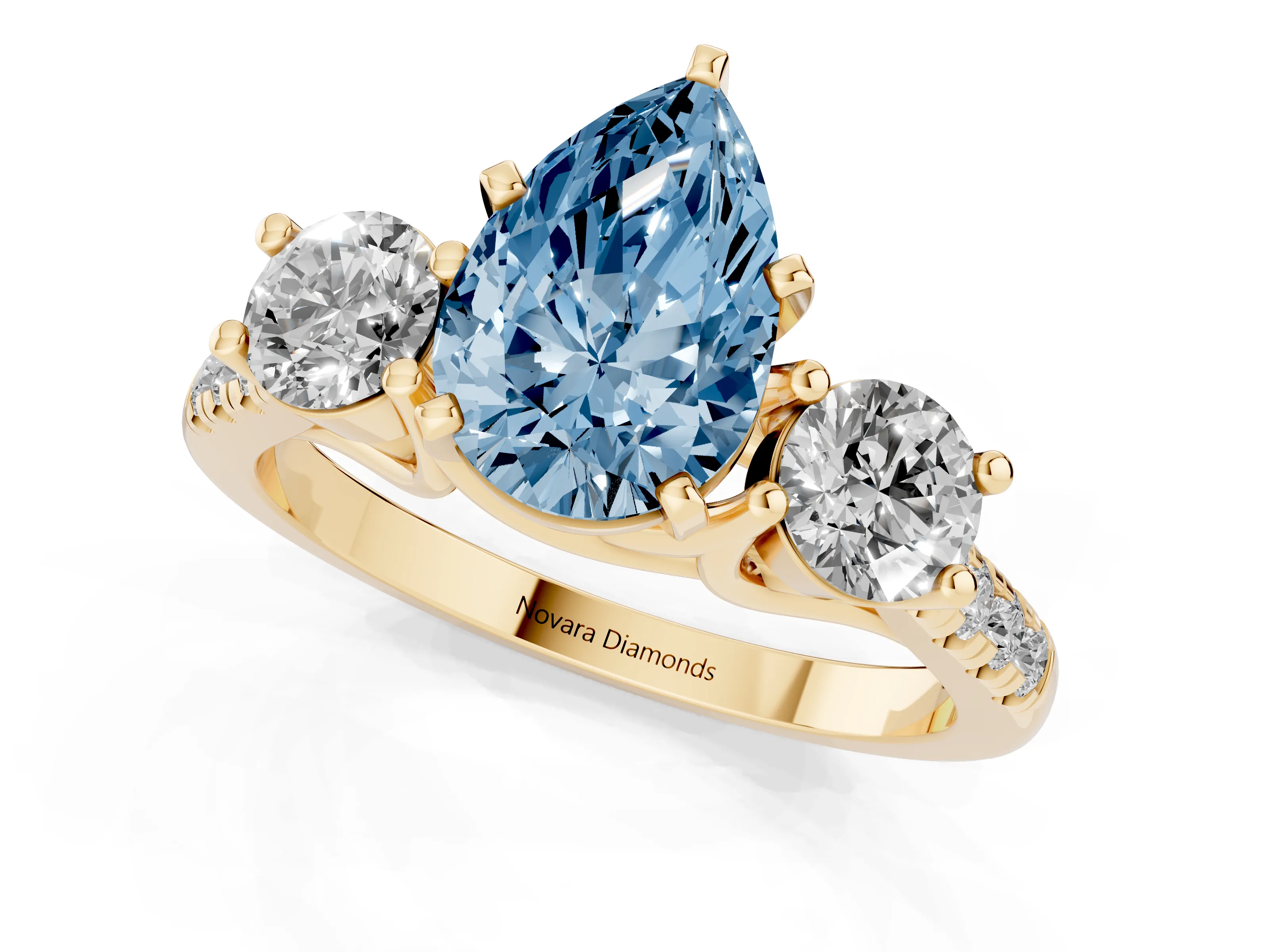 Fancy Blue Three-Stone Pear Cut Diamond Pavé Band Ring Set in Yellow gold with Prong-Set Trio