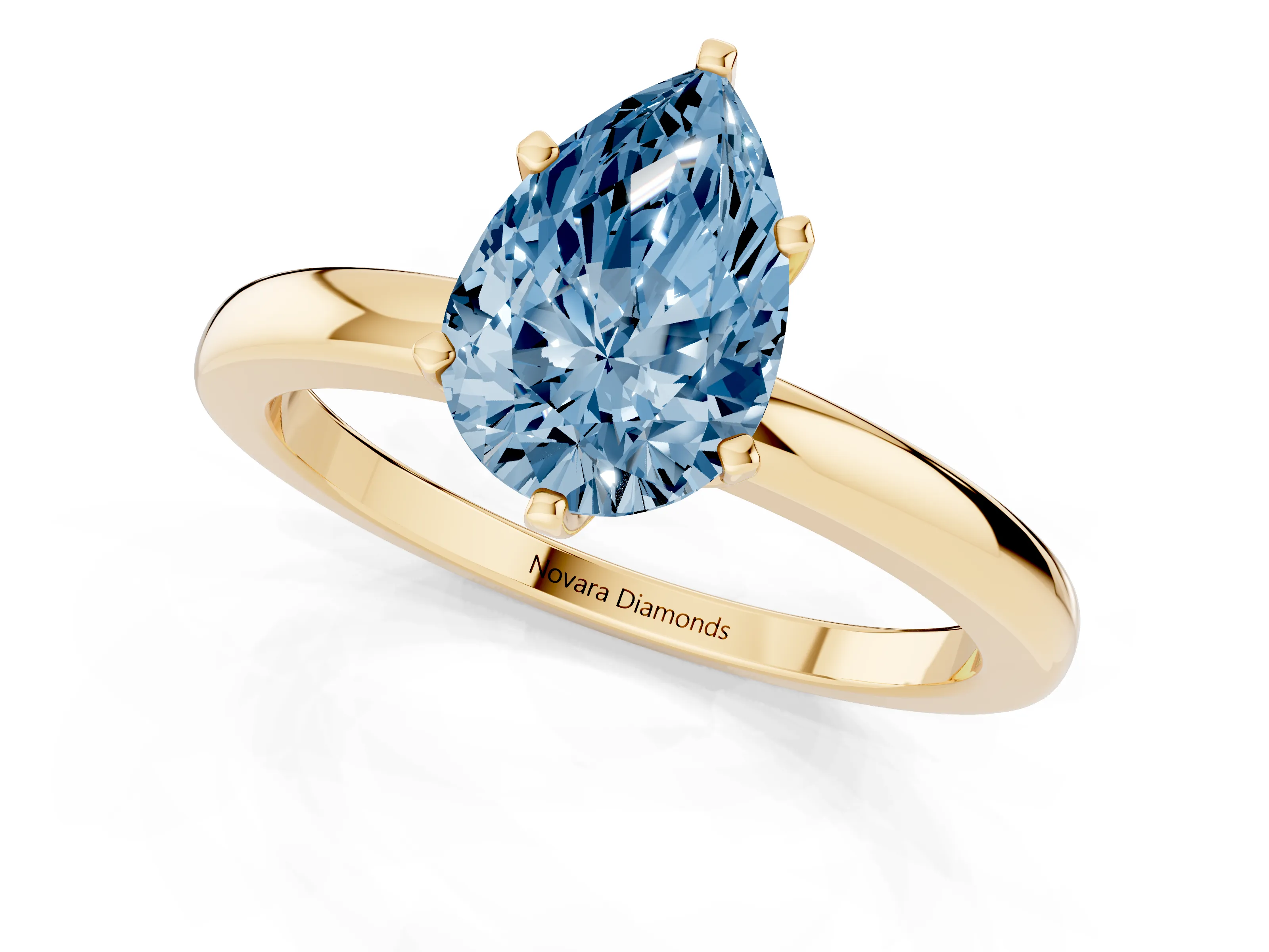 Fancy Blue Pear Cut Diamond Solitaire Ring Set in Yellow gold with Raised Prong Setting on a Classic Band