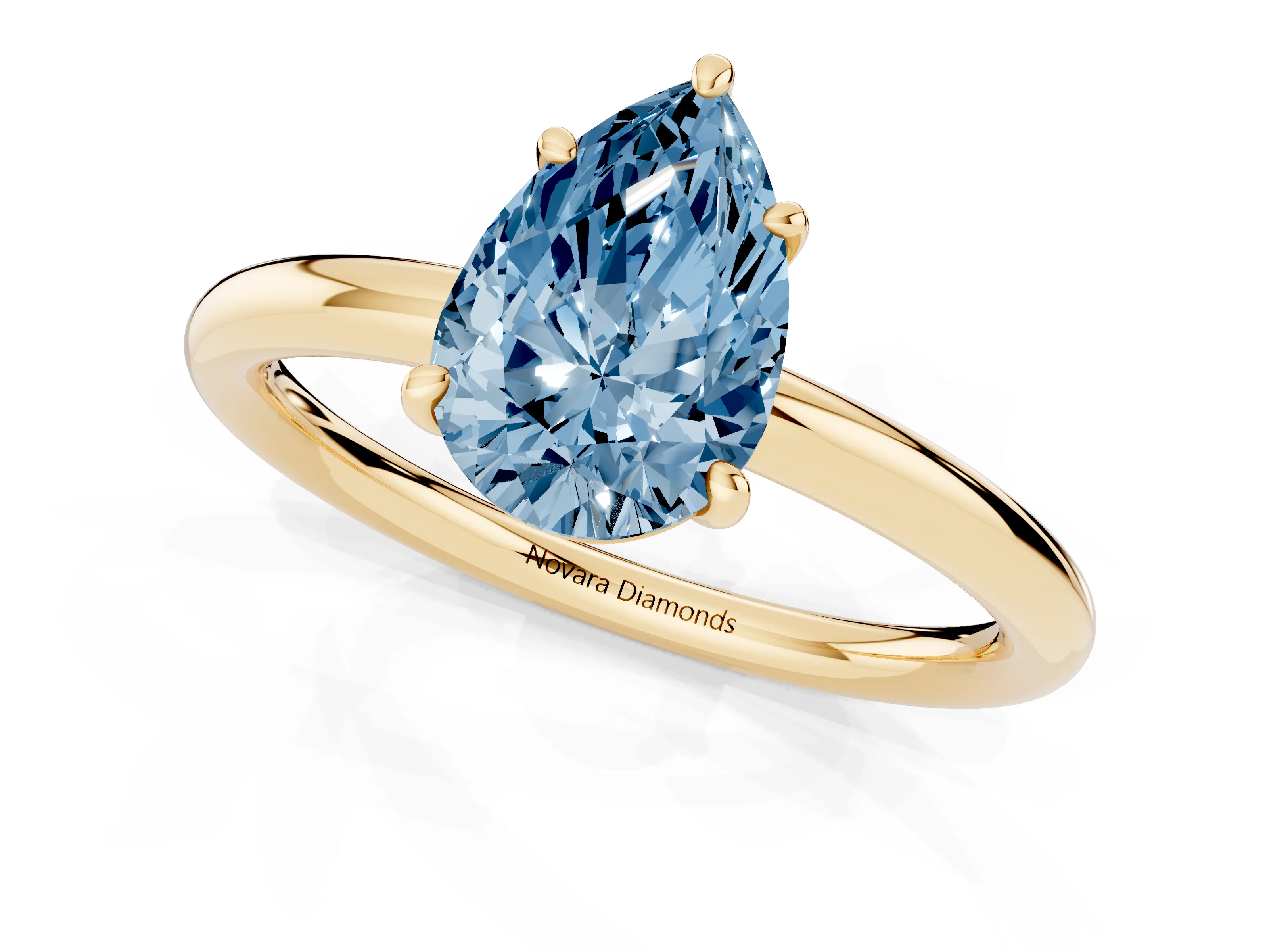 Fancy Blue Pear Cut Diamond Solitaire Ring Set in Yellow gold with Prong Setting on a Polished Plain Band