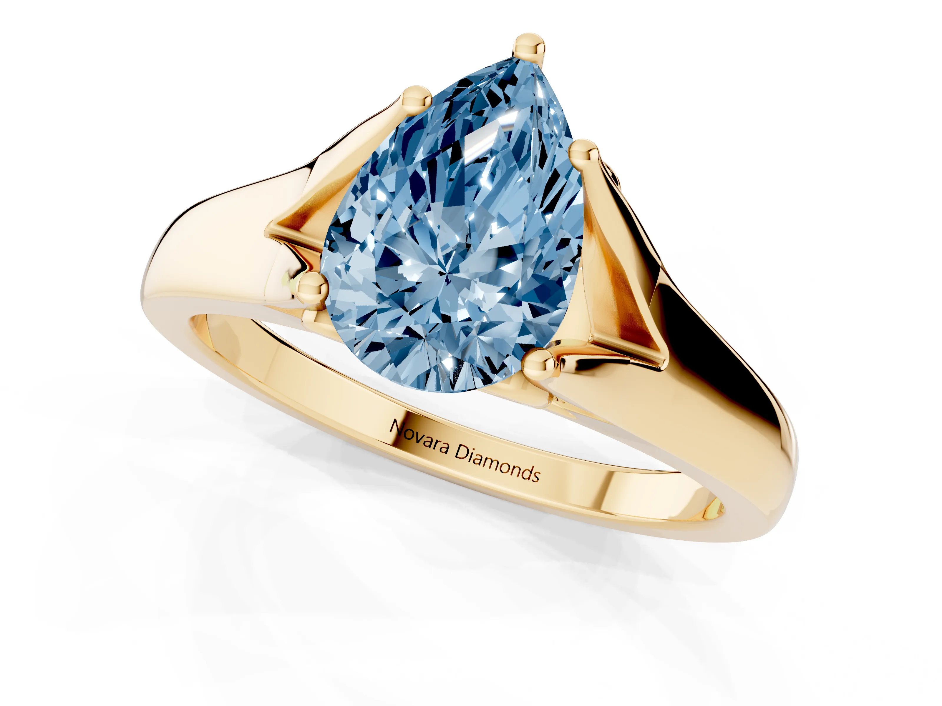 Fancy Blue Pear Cut Diamond Solitaire Ring Set in Yellow gold with Arched Cathedral Band and Prong Setting