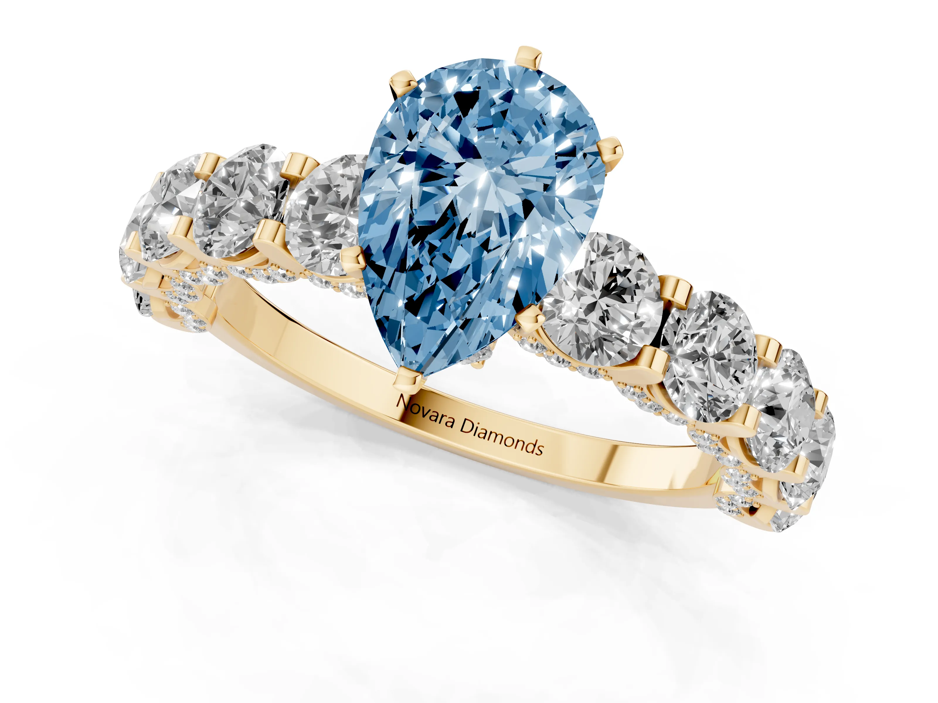 Fancy Blue Pear Cut Diamond Side Stone Ring Set in Yellow gold with Alternating Round and Oval Side Stones