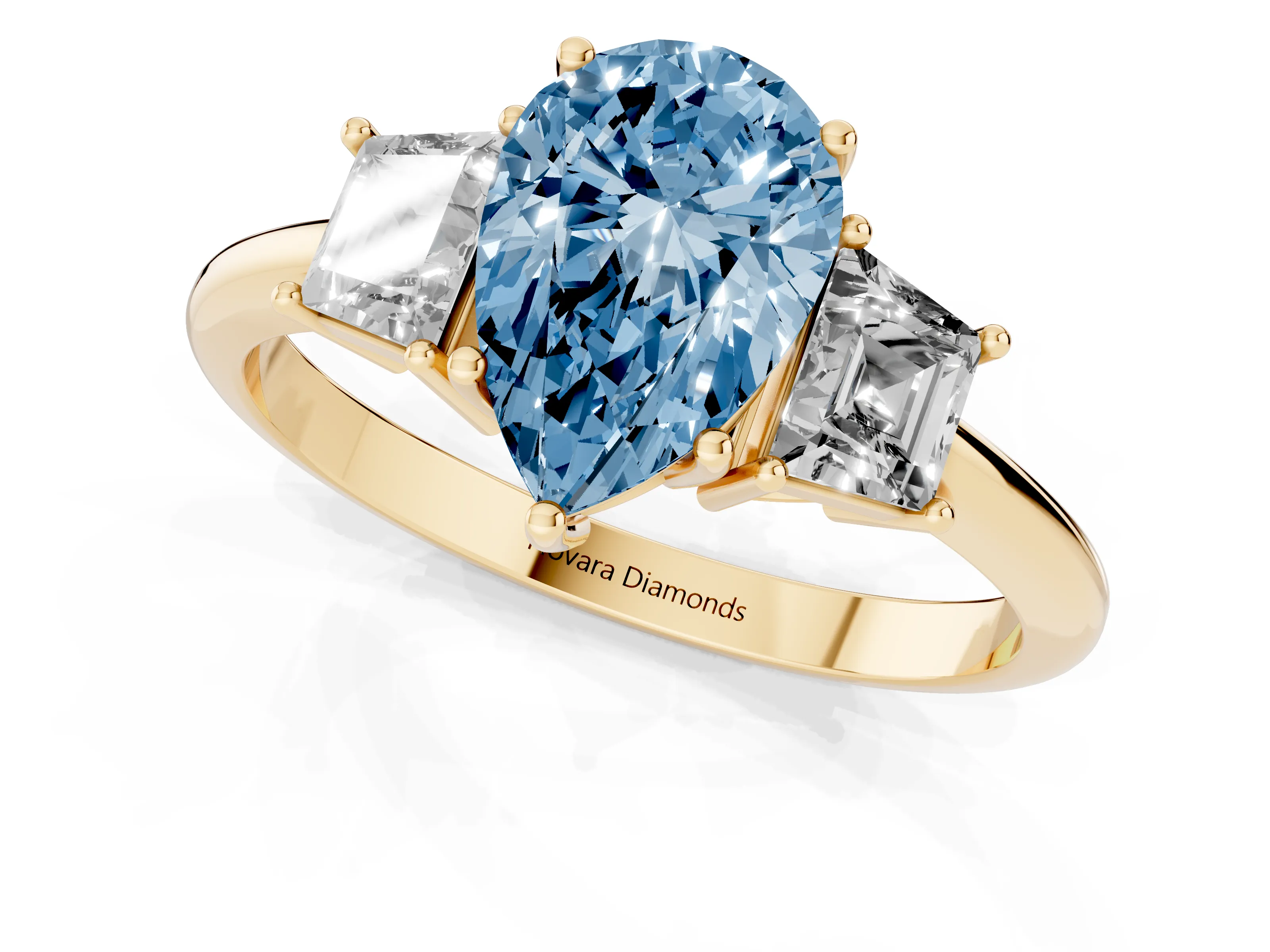 Fancy Blue Pear Cut Diamond Three-Stone Ring Set in Yellow gold with Trapezoid Side Stones and Prong Setting