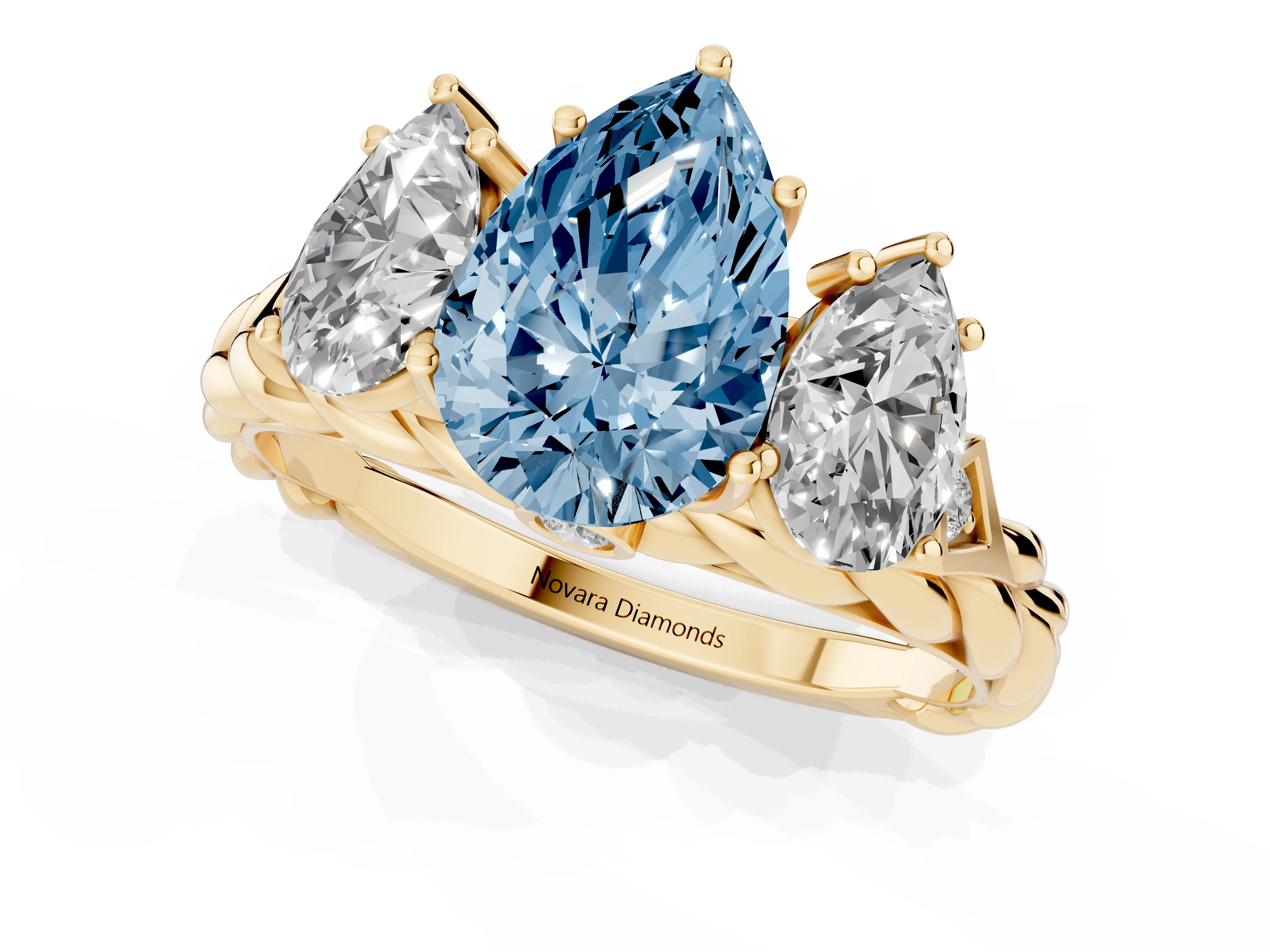 Fancy Blue Pear Cut Diamond Three-Stone Ring Set in Yellow gold with Braided Band