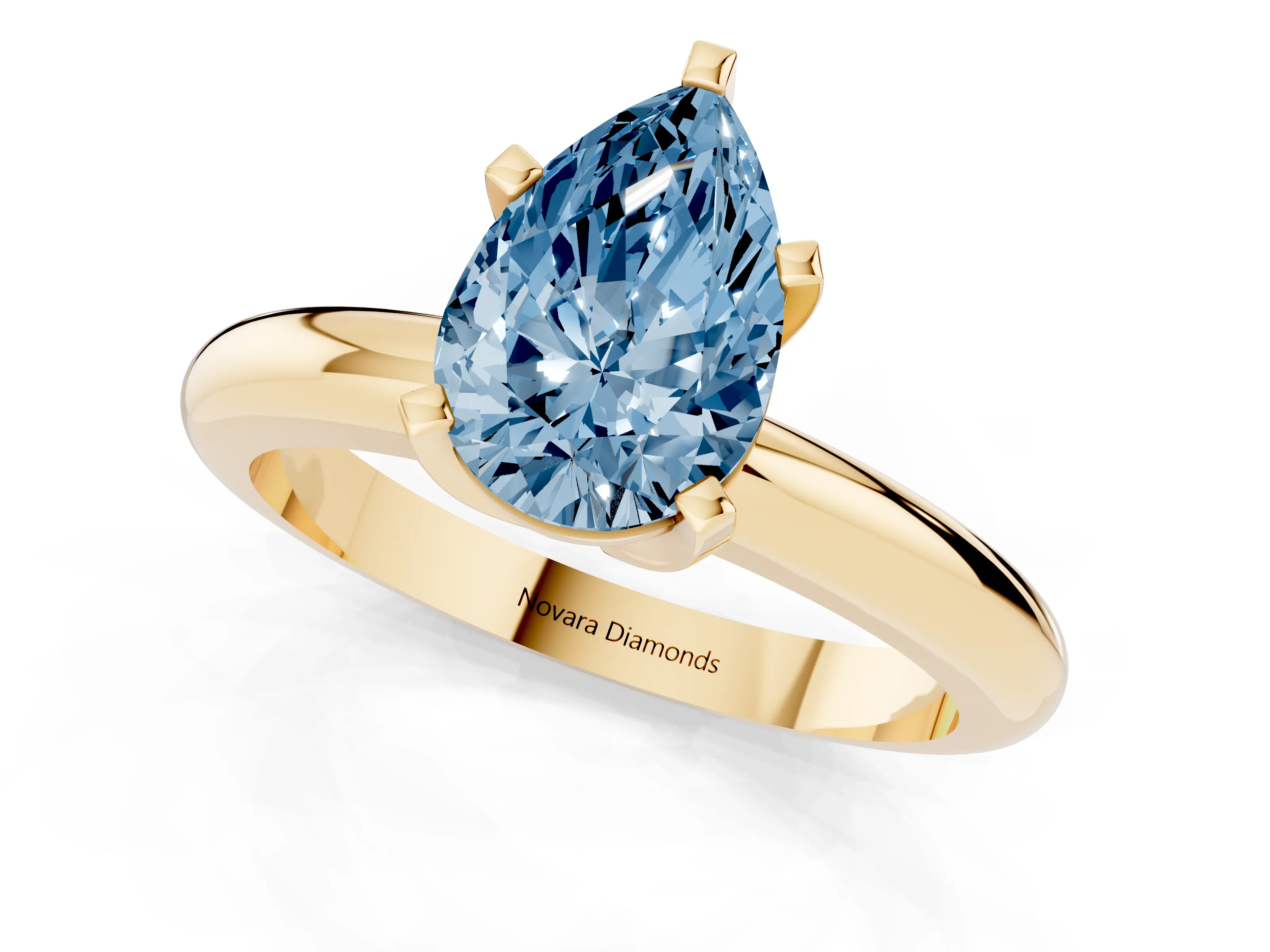Fancy Blue Pear Cut Diamond Solitaire Engagement Ring Set in Yellow gold with Round Band and Prong Setting
