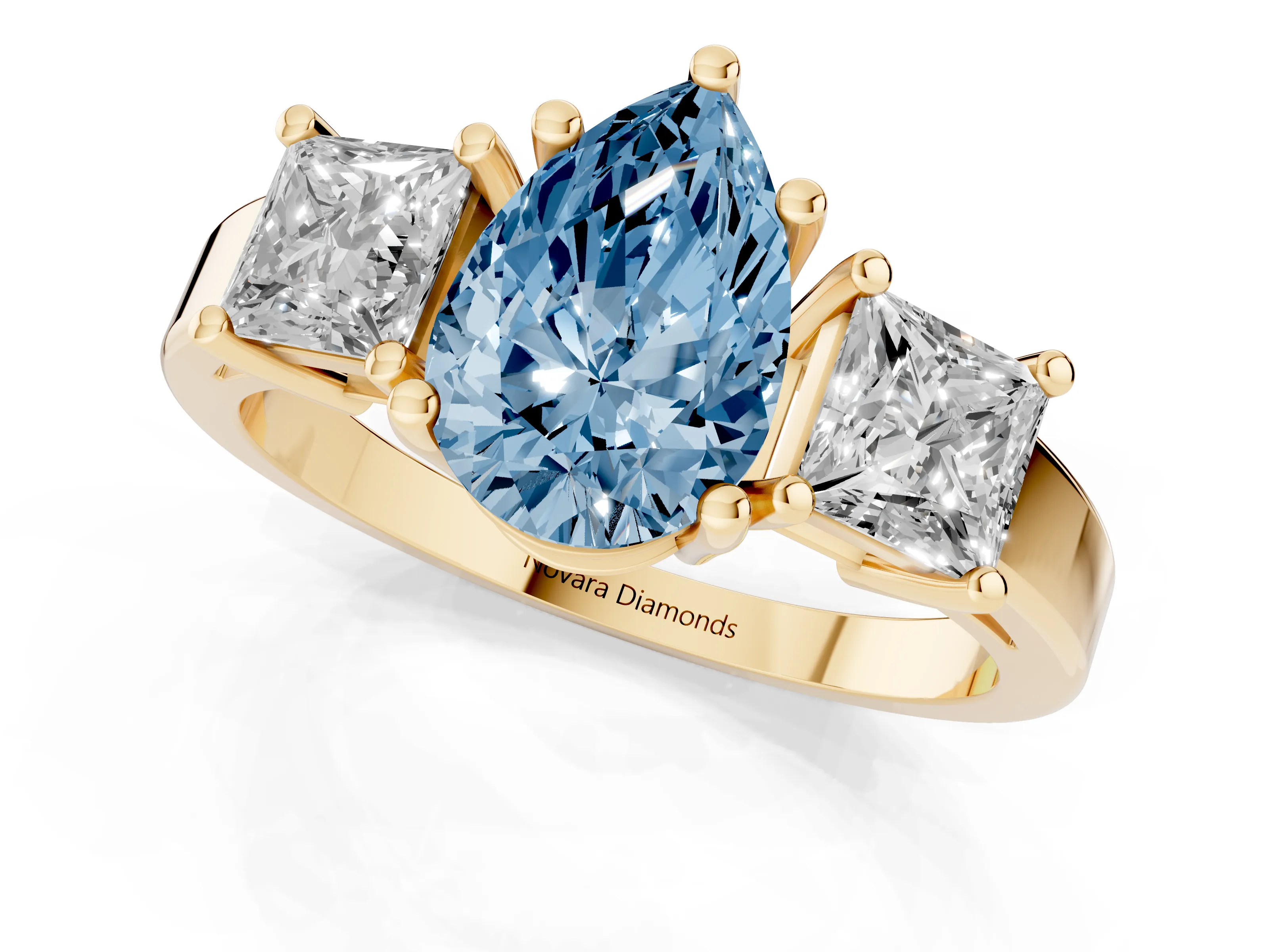 Fancy Blue Three-Stone Pear Cut Diamond Solitaire Ring Set in Yellow gold with Prong Setting