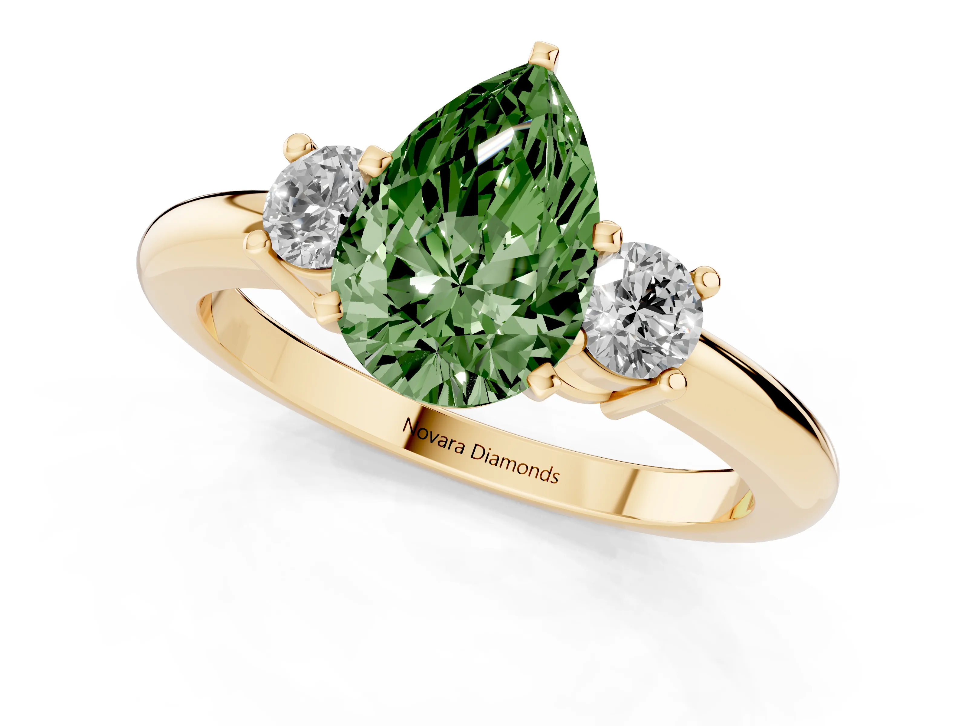 Fancy Green Three-Stone Pear Cut Diamond Ring Set in Yellow gold with Prong Setting and Plain Band