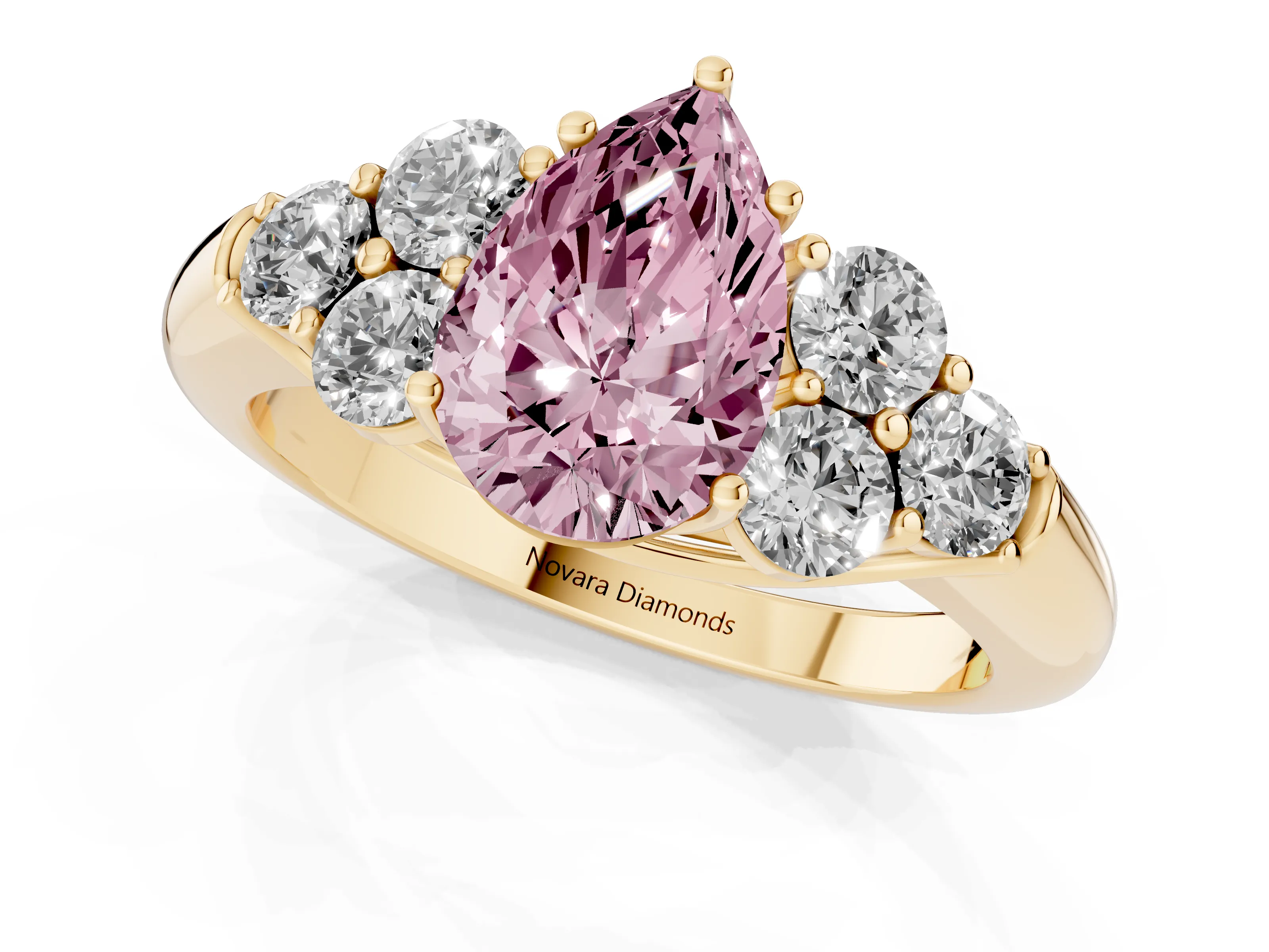 Fancy Pink Pear Cut Diamond Cluster Ring Set in Yellow gold with Round Accent Stones and Prong Setting on a Plain Band