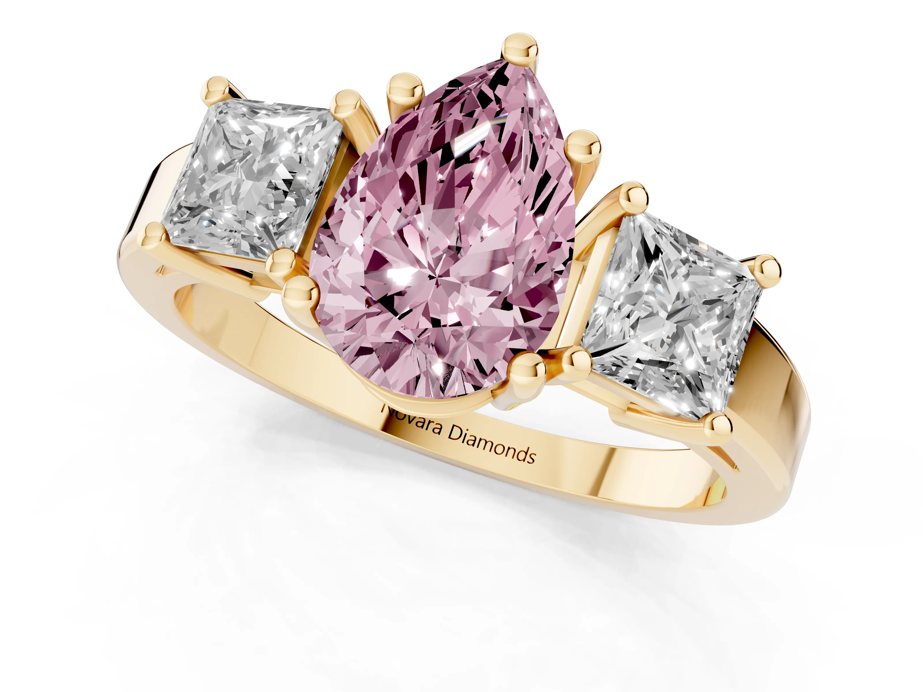 Fancy Pink Three-Stone Pear Cut Diamond Solitaire Ring Set in Yellow gold with Prong Setting
