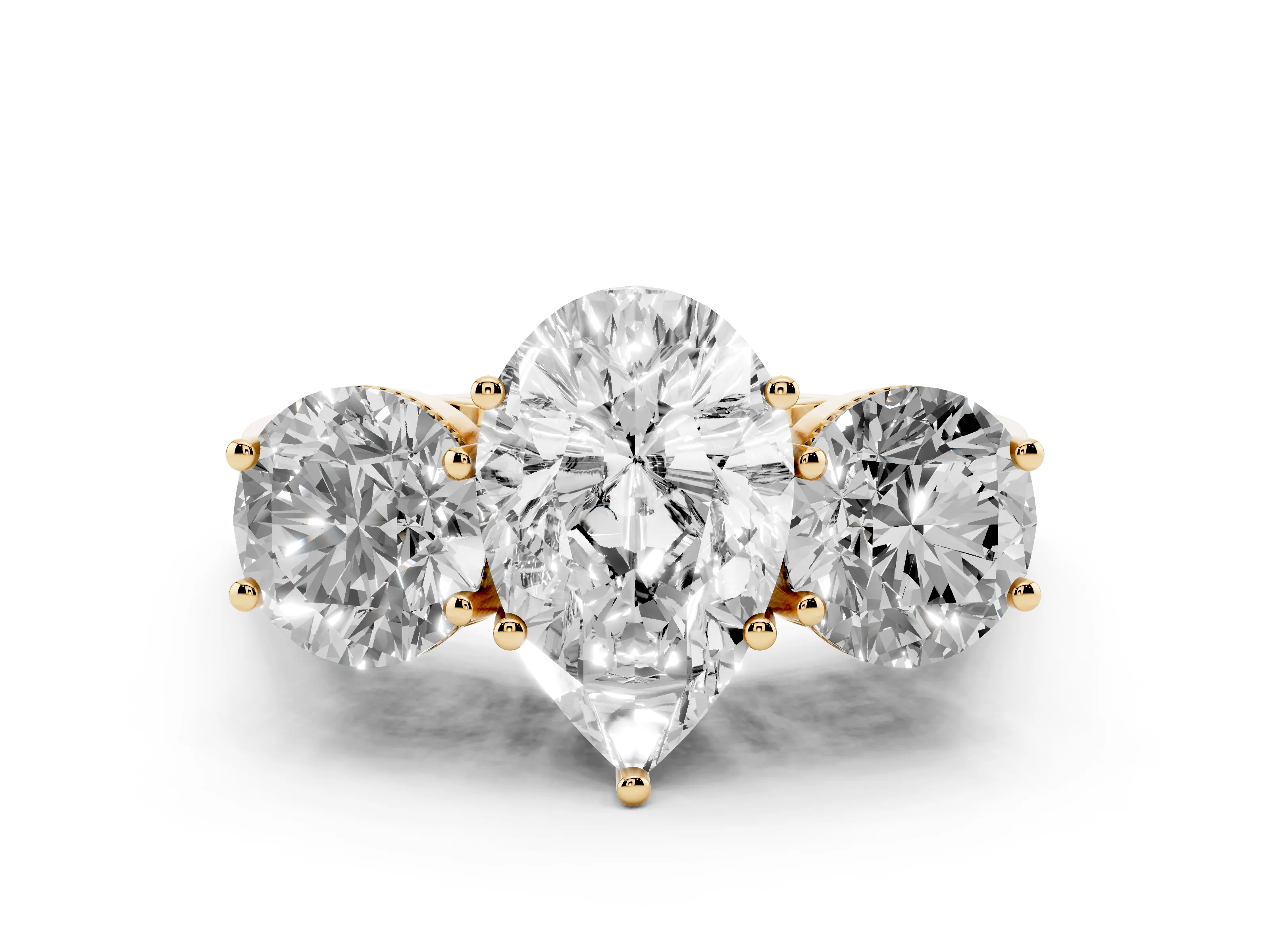 Pear Cut Diamond Three-Stone Engagement Ring Set in Yellow gold with Polished Band