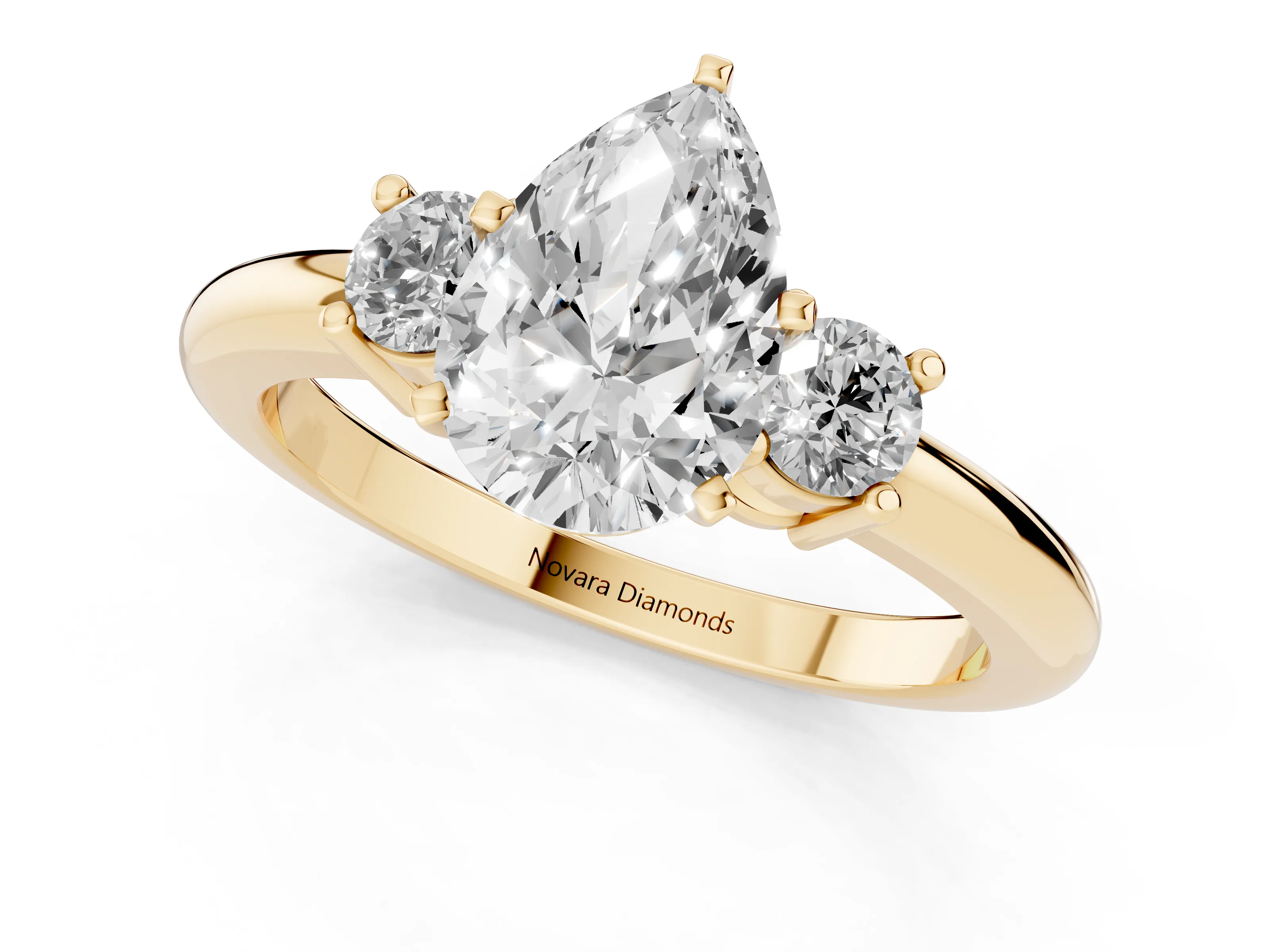 Three-Stone Pear Cut Diamond Ring Set in Yellow gold with Prong Setting and Plain Band