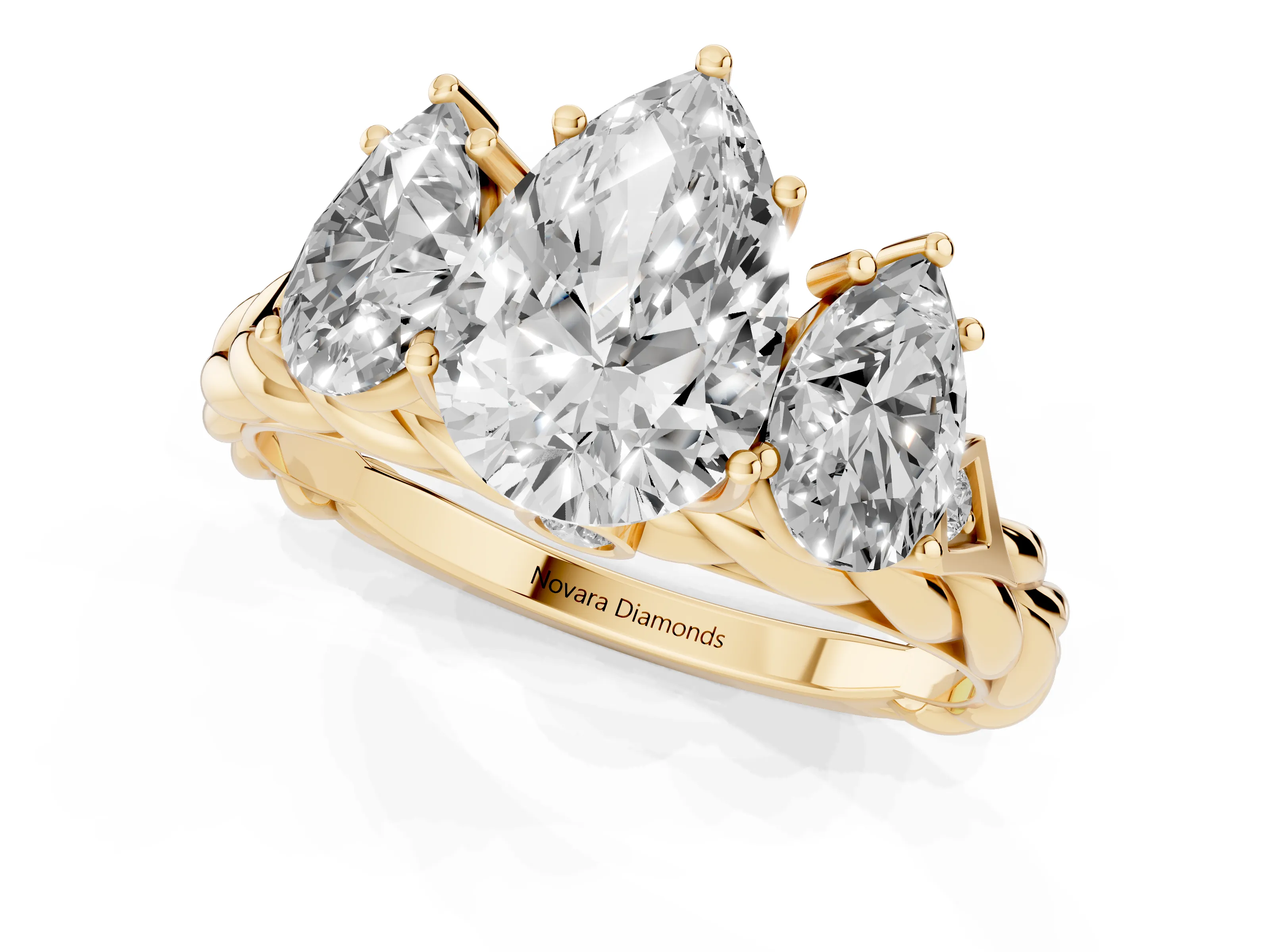 Pear Cut Diamond Three-Stone Ring Set in Yellow gold with Braided Band