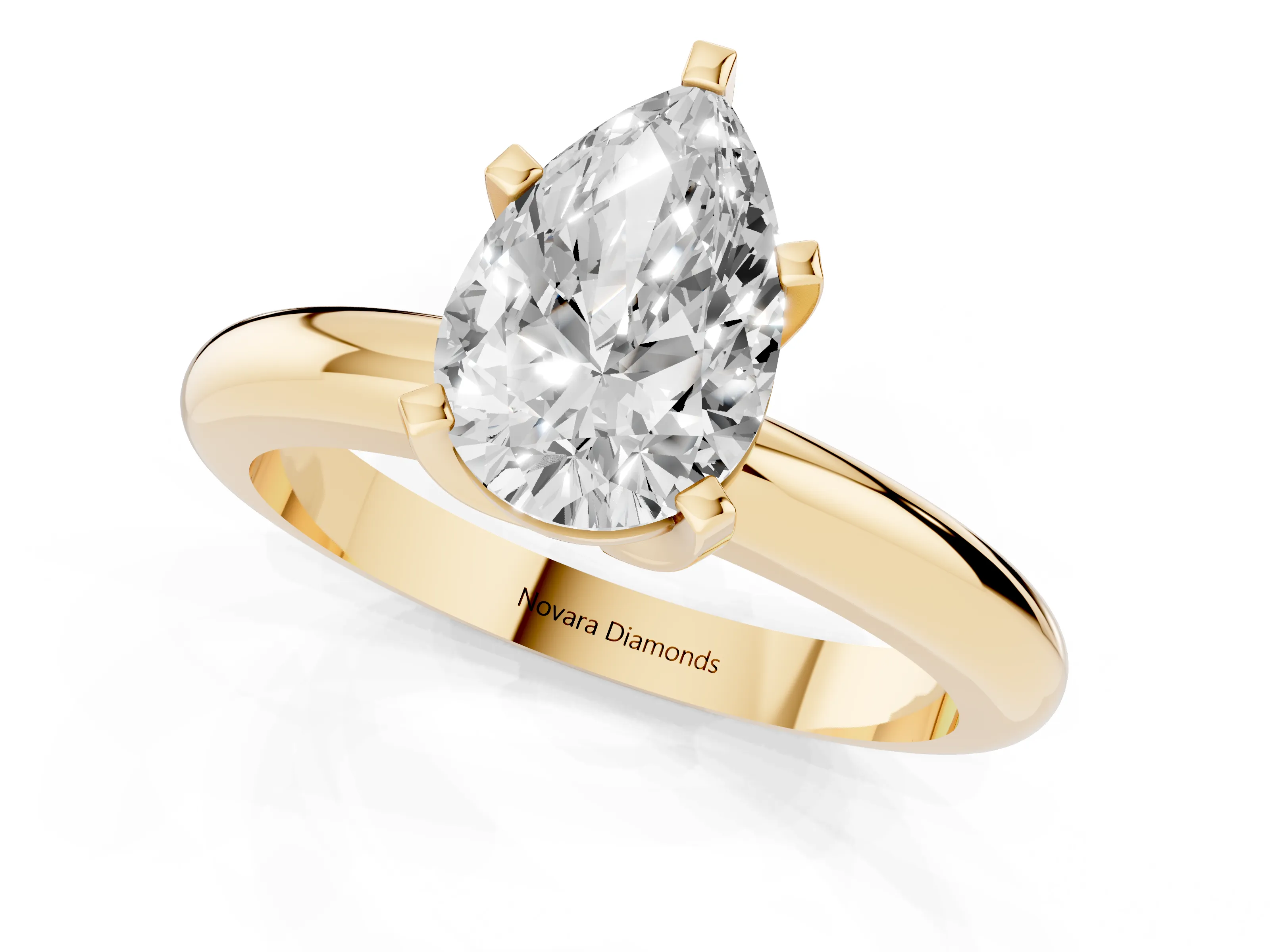 Pear Cut Diamond Solitaire Engagement Ring Set in Yellow gold with Round Band and Prong Setting