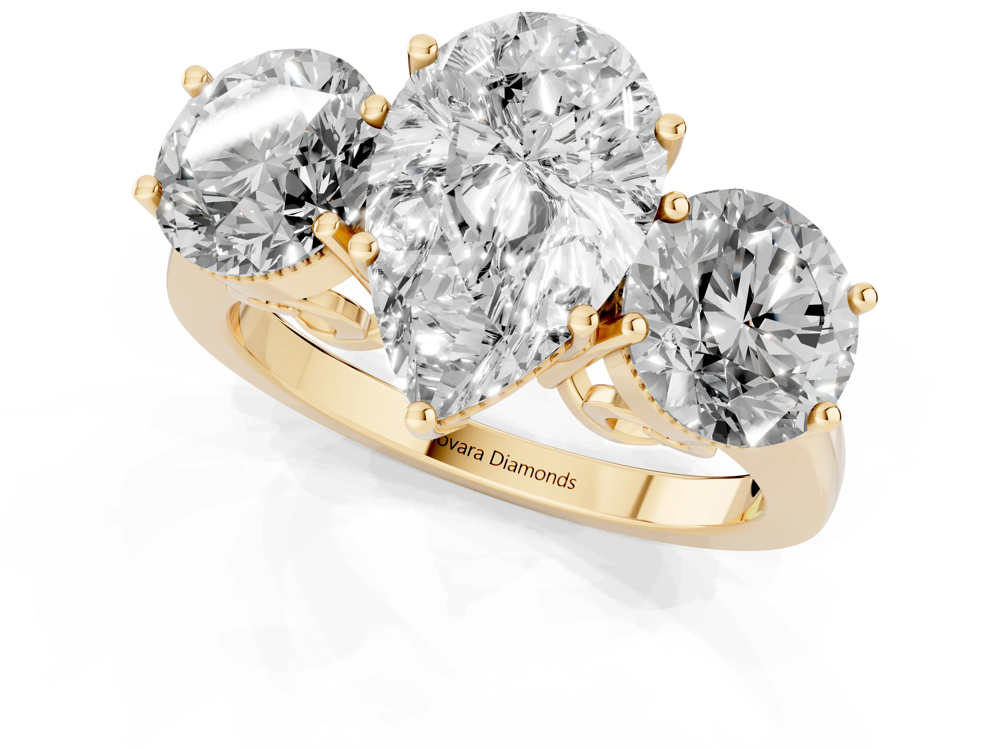 Pear Cut Diamond Three-Stone Engagement Ring Set in Yellow gold with Polished Band