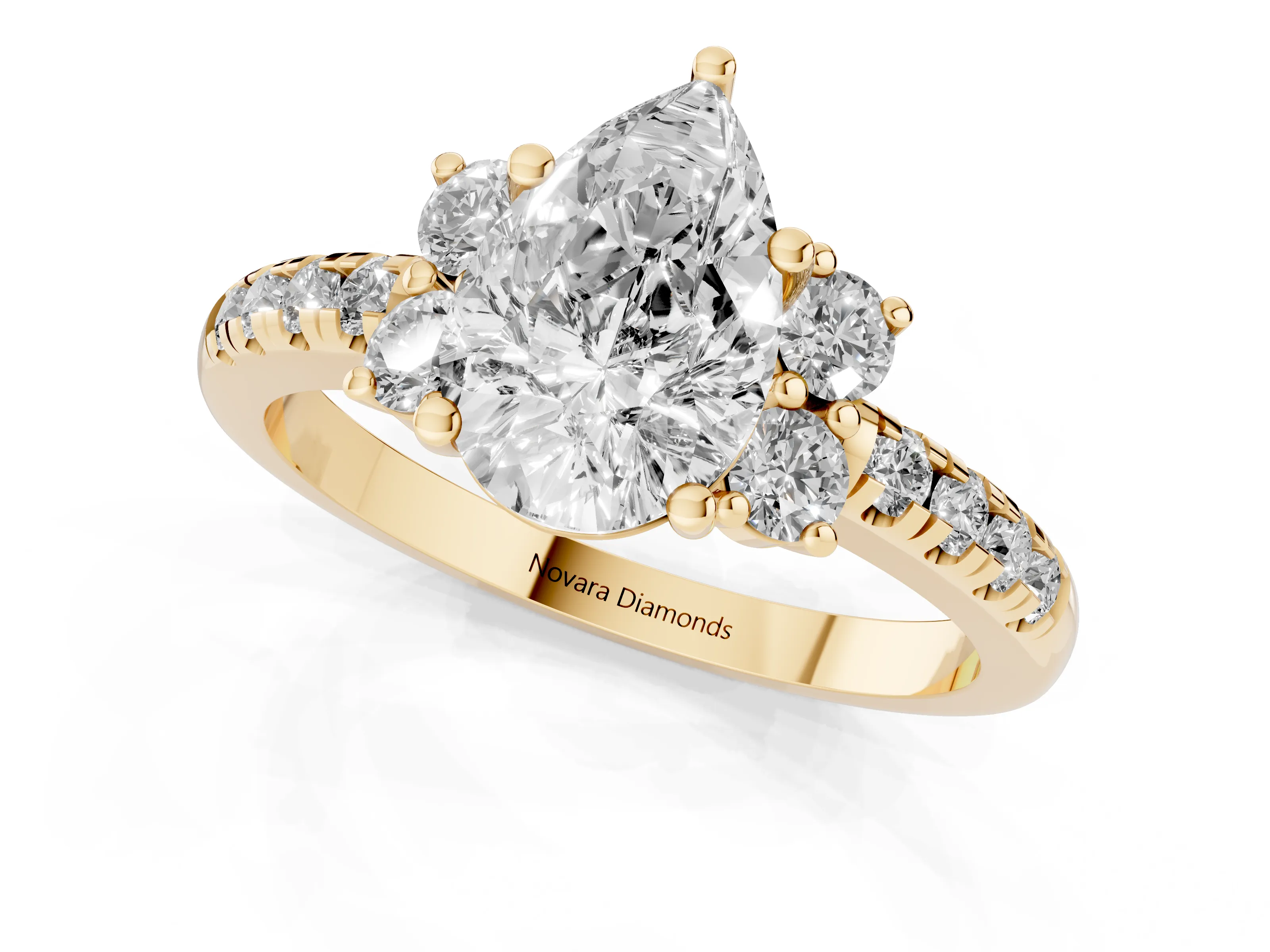 Pear Cut Diamond Three-Stone Pavé Ring Set in Yellow gold with Prong Setting