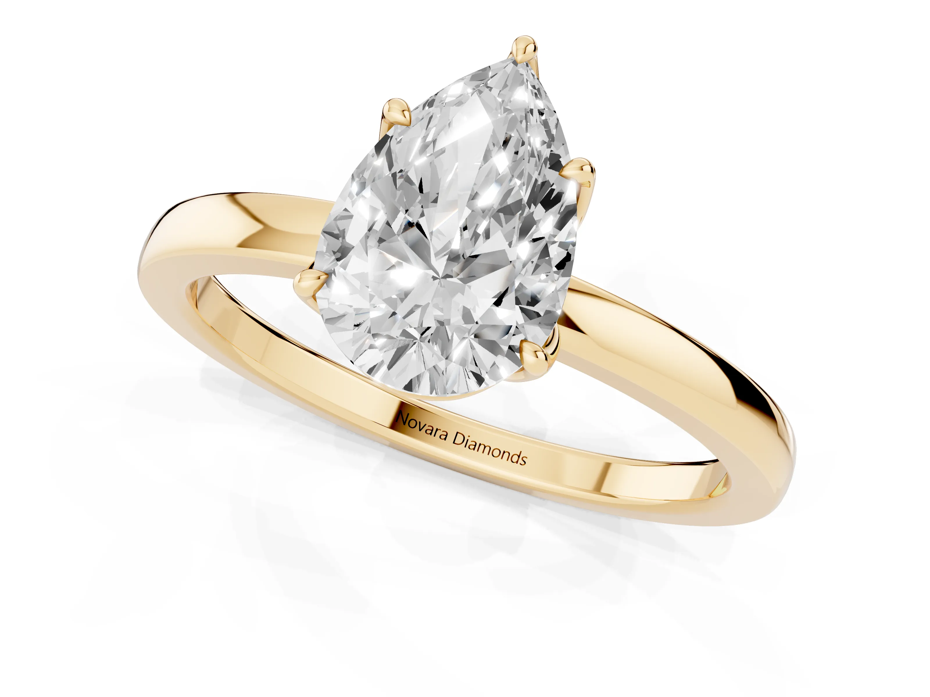 Pear Cut Diamond Solitaire Ring Set in Yellow gold with Prong Setting and Thin Polished Band