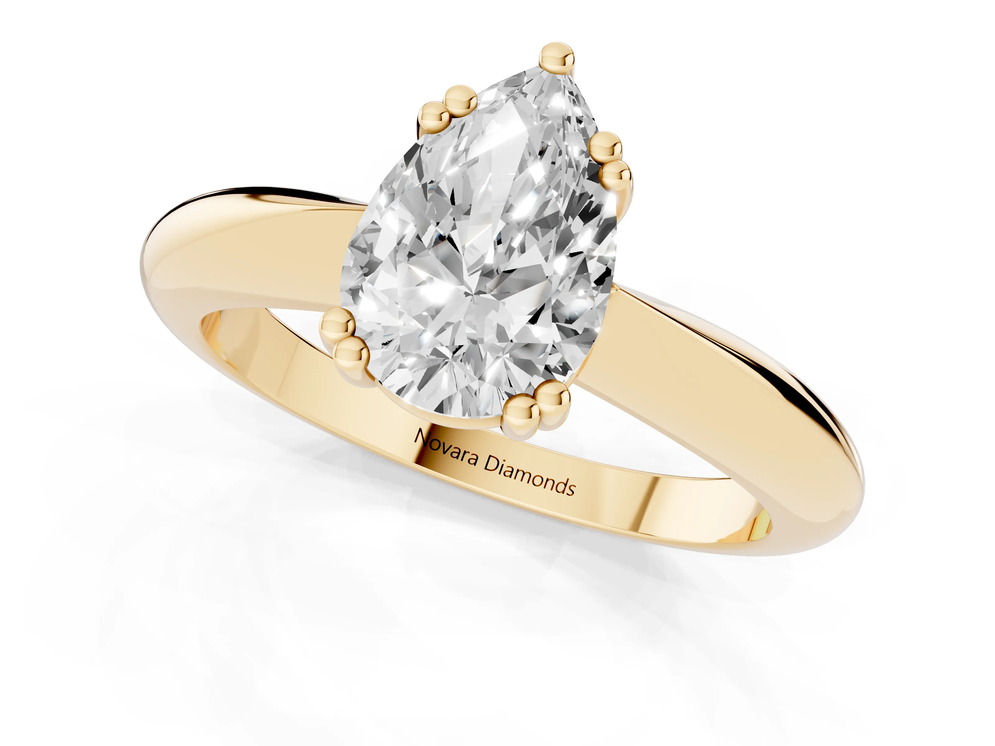 Pear Cut Diamond Solitaire Engagement Ring Set in Yellow gold with Tapered Band and Prong Setting