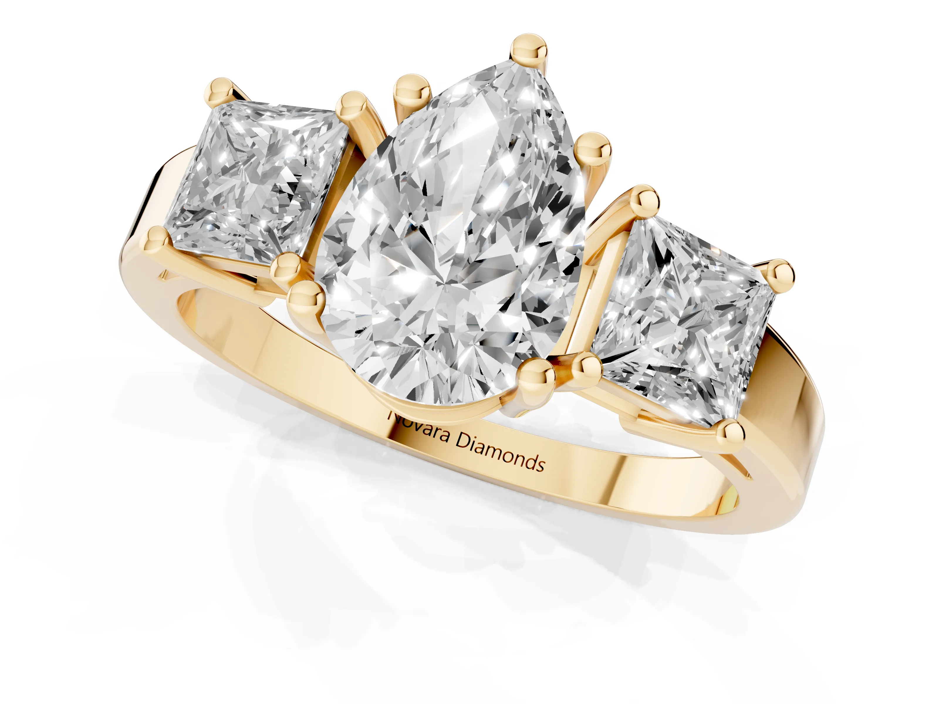 Three-Stone Pear Cut Diamond Solitaire Ring Set in Yellow gold with Prong Setting