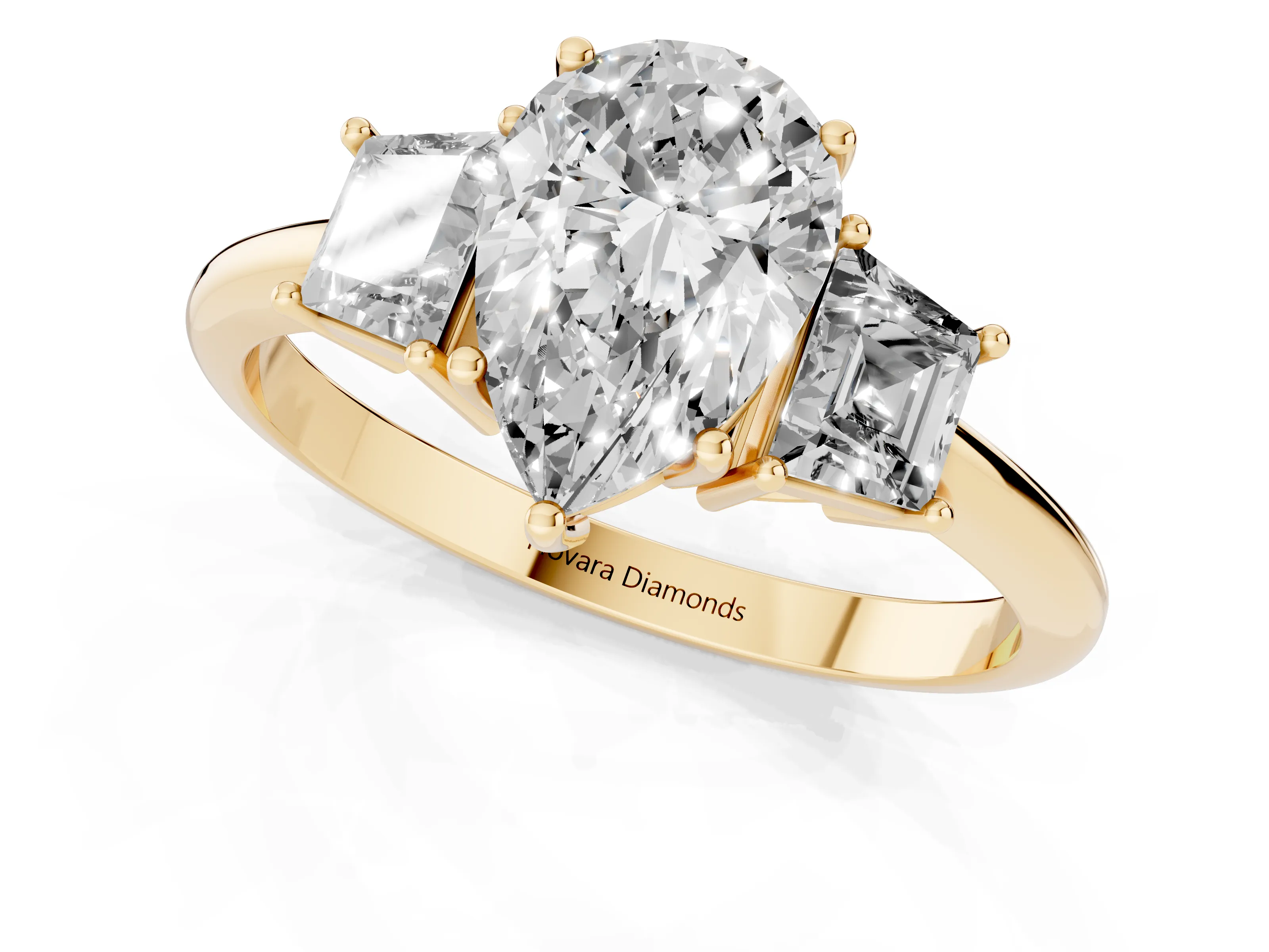 Pear Cut Diamond Three-Stone Ring Set in Yellow gold with Trapezoid Side Stones and Prong Setting