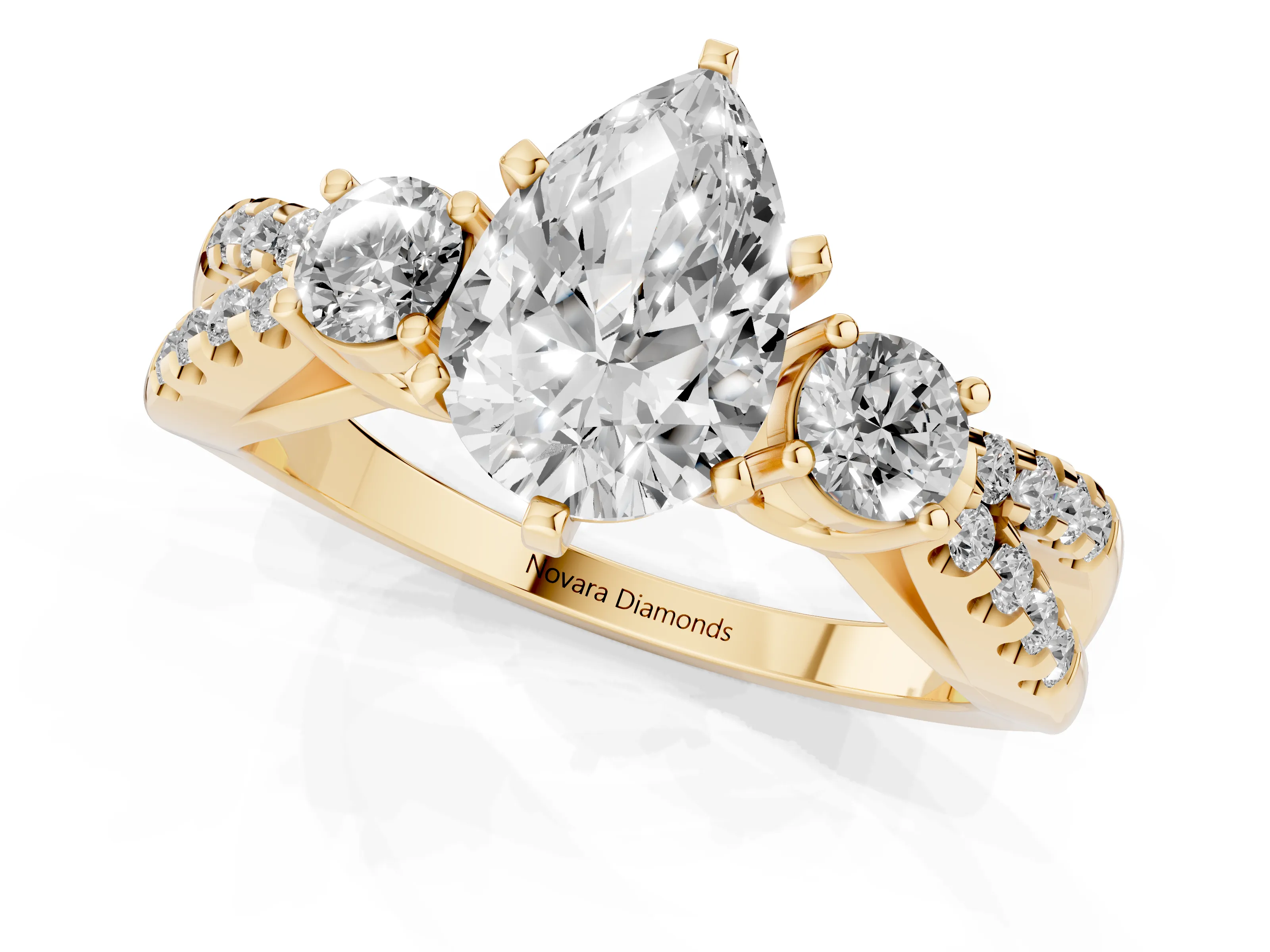 Pear Cut Diamond Three-Stone Ring Set in Yellow gold with Pavé Split Shank and Prong Setting