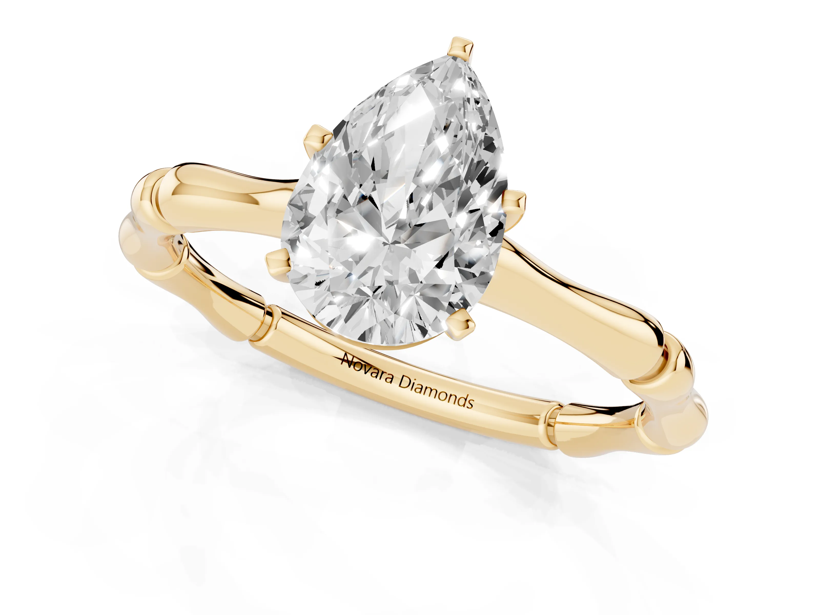 Pear Cut Diamond Solitaire Ring Set in Yellow gold with Bamboo Band and Prong Setting