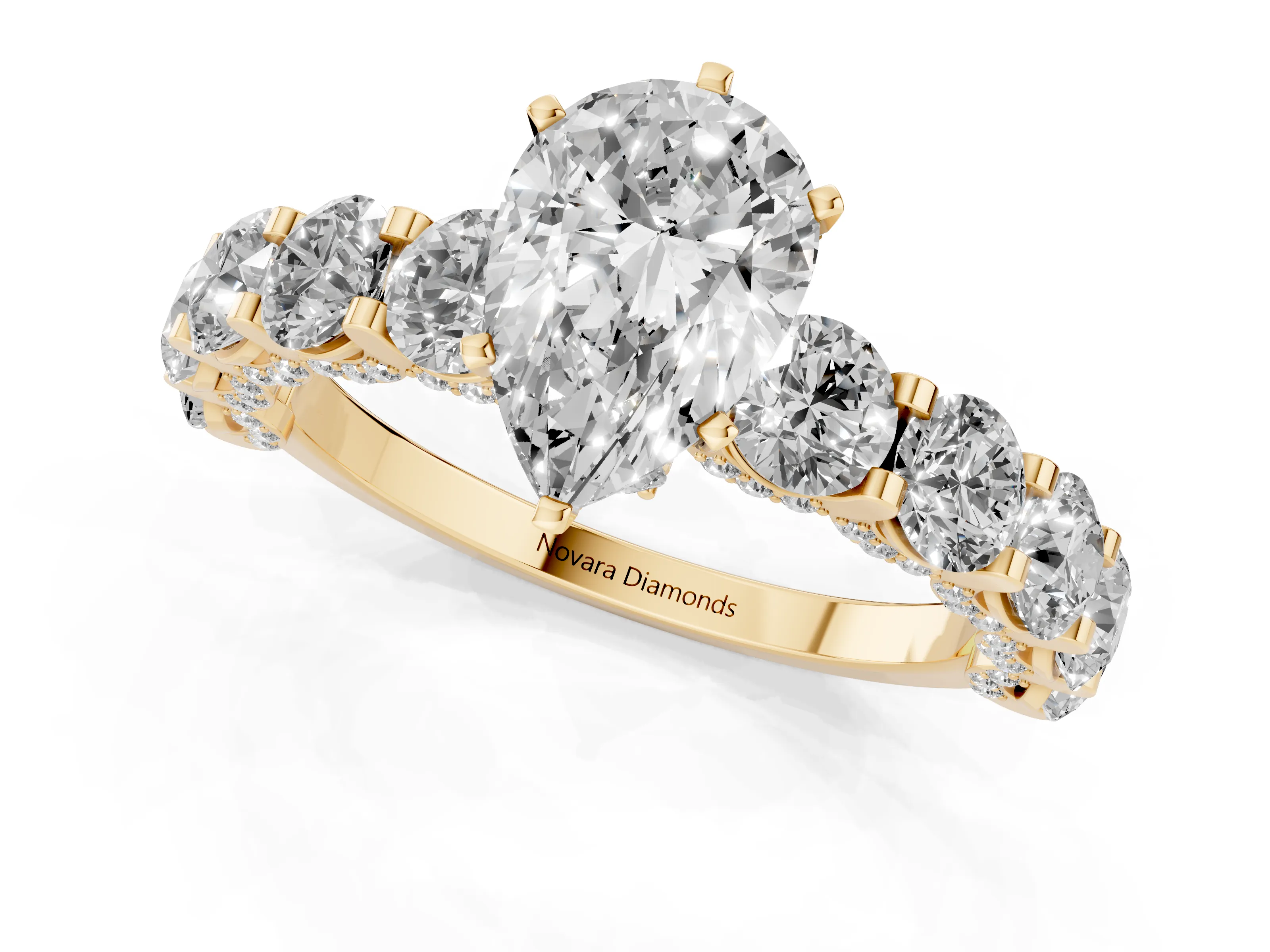 Pear Cut Diamond Side Stone Ring Set in Yellow gold with Alternating Round and Oval Side Stones