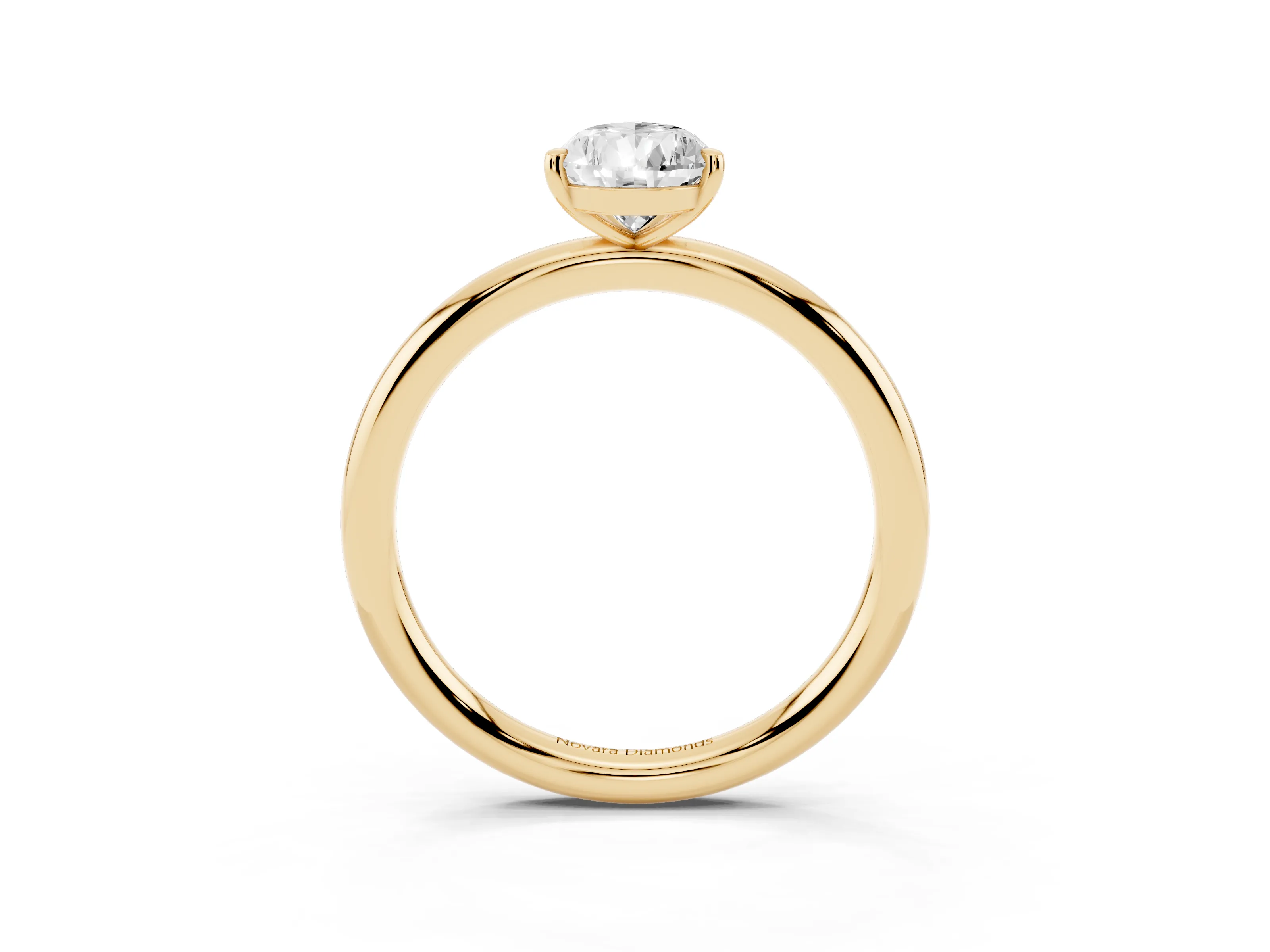 Pear Cut Diamond Solitaire Ring Set in Yellow gold with Prong Setting on a Polished Plain Band