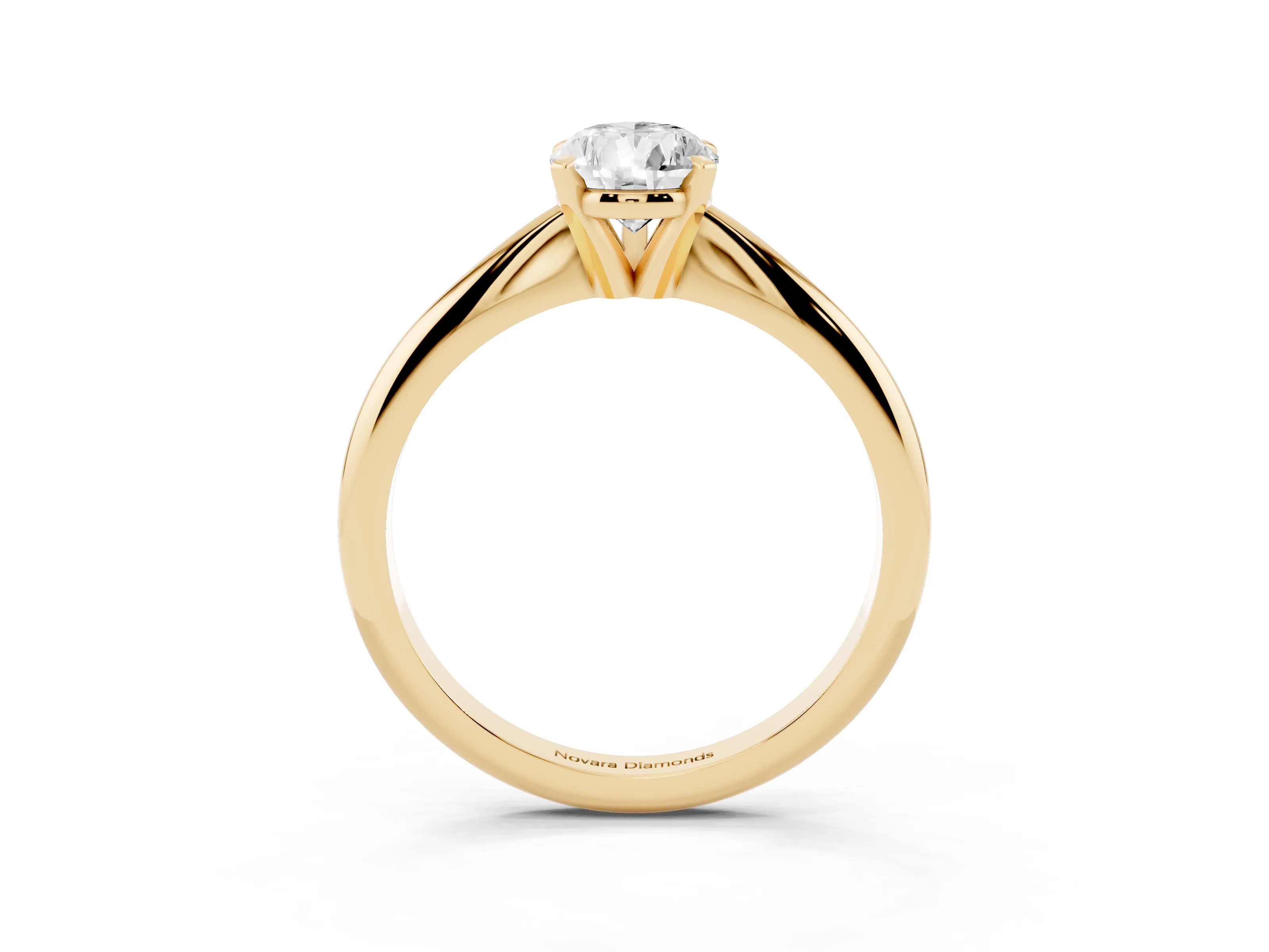 Pear Cut Diamond Solitaire Ring Set in Yellow gold with Prong Setting on a Plain Round Band